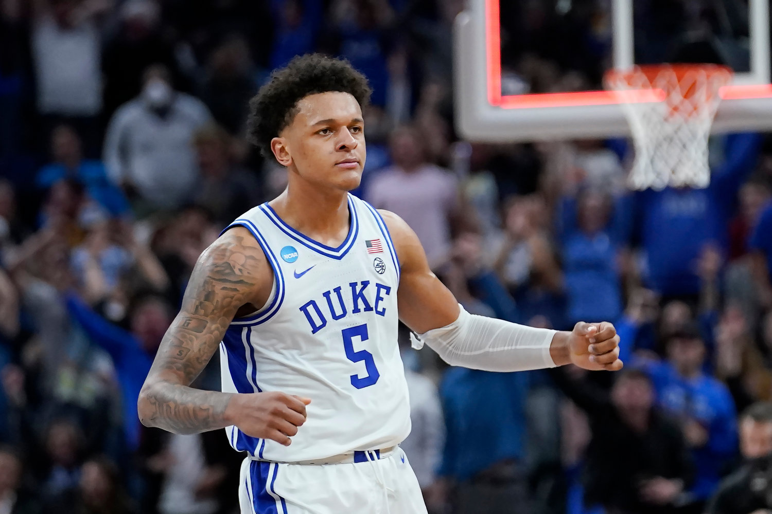 FILE - Duke forward Paolo Banchero (5) celebrates during the first half of the team's game against Arkansas in the NCAA men's basketball tournament in San Francisco, March 26, 2022. Banchero is one of the top forwards in the upcoming NBA draft. (AP Photo/Marcio Jose Sanchez, File)