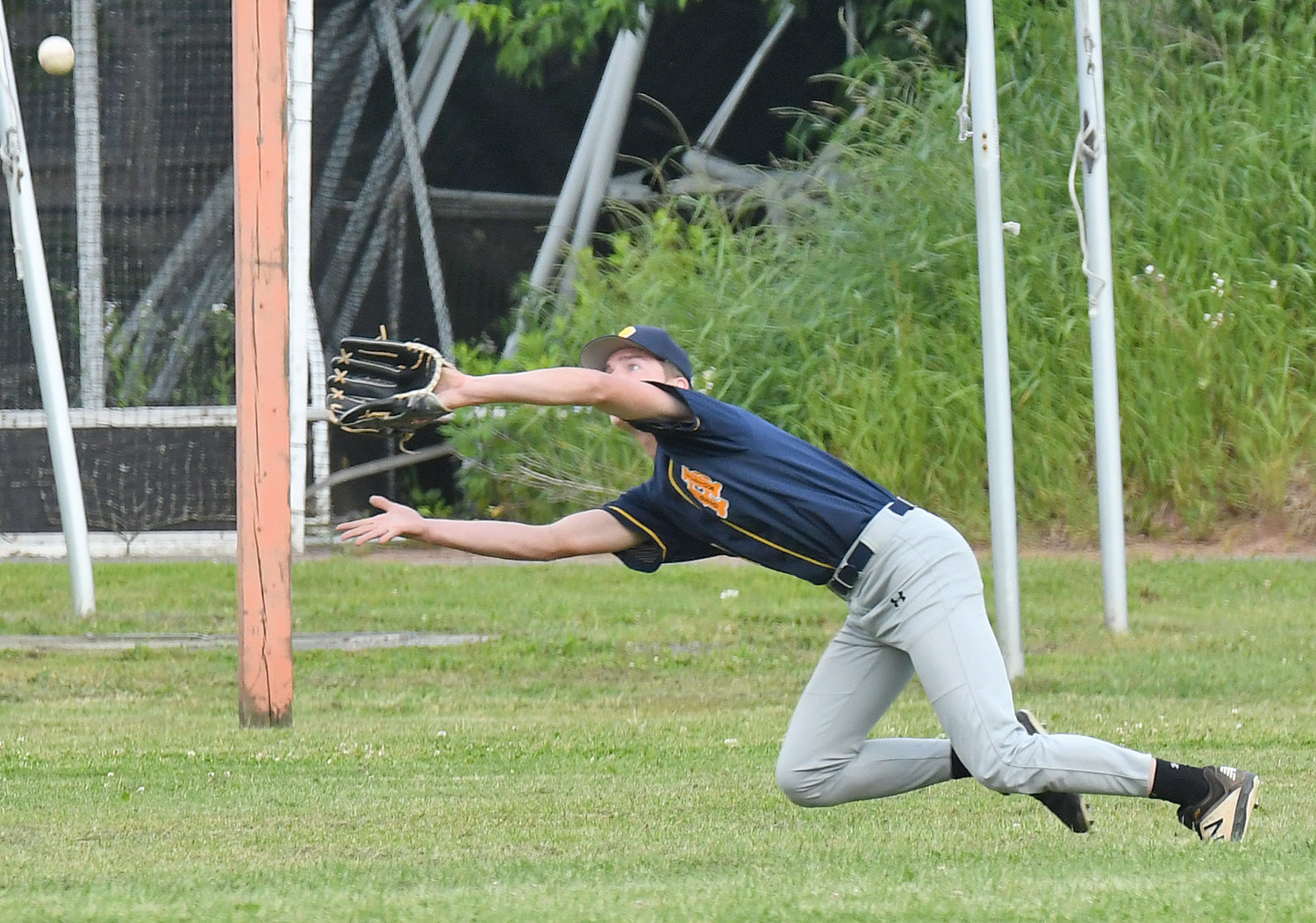 Ilion Post outfielder Will Maxwell dives to make the catch against Smith Post Wednesday night at RFA Stadium Field in Rome. The visitors won 5-4 in District V American Legion baseball.