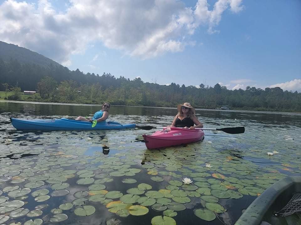 Megan Plete Postol, left, and  Lindsay Maida kayaking in the Southern Adirondacks.