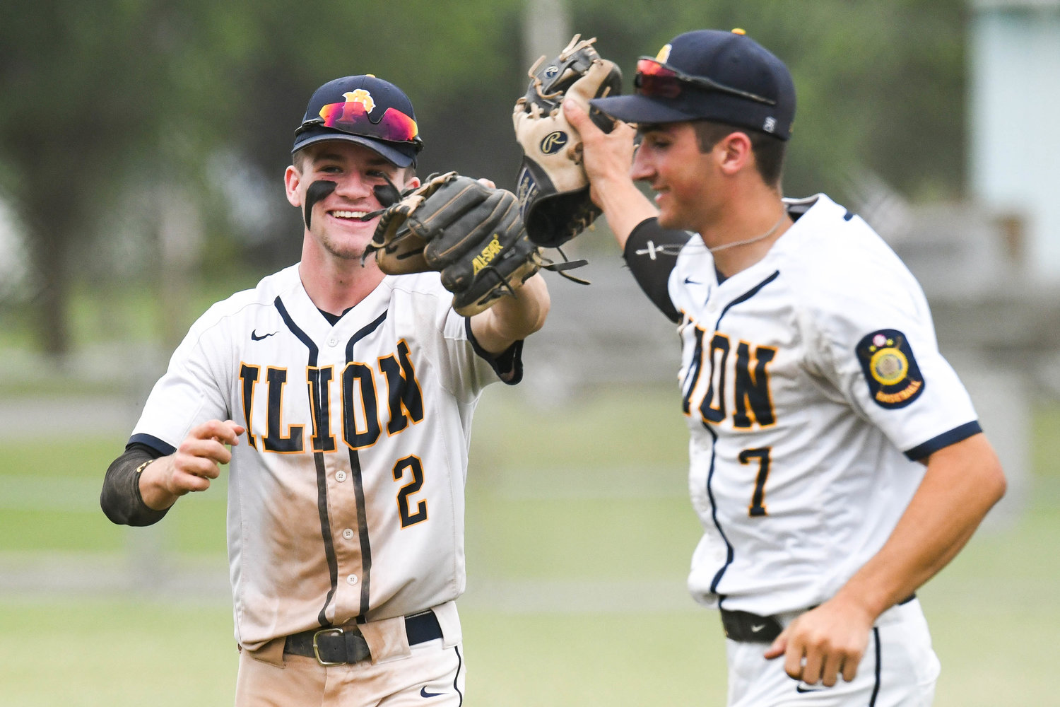Ilion Post’s Tanner Warren (2) and Alan Meszler (7) celebrate after making an out during the game against Utica Post on Wednesday at Central Valley Academy in Ilion. Utica Post won 12-10 in eight innings.