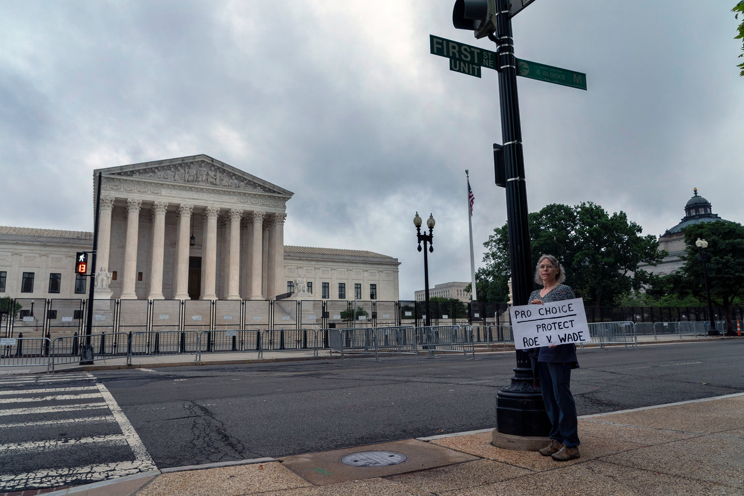 An abortion-rights activist stands outside the U.S. Supreme Court, Thursday, June 23, 2022, in Washington. (AP Photo/Gemunu Amarasinghe)