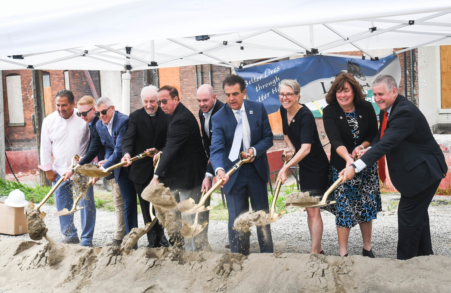 New York State Homes and Community Renewal, Liberty Affordable Housing elected officials and community leaders break ground to celebrate the start of the $67 million project to rehabilitate and modernize Utica's historical Olbiston Apartments.