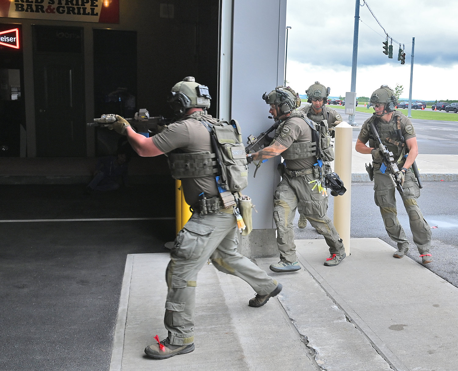 Members of the Erie County Sheriff's SWAT team head inside a training scenario at Cityscape at the New York State Preparedness Training Center in Whitestown on Thursday.