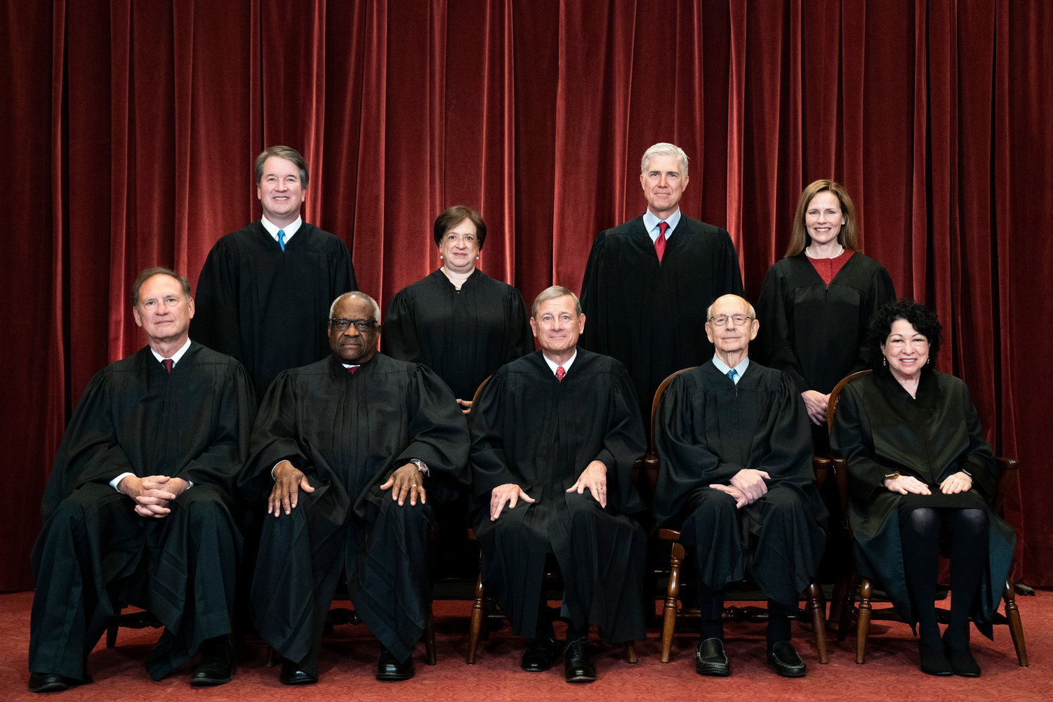FILE - Members of the Supreme Court pose for a group photo at the Supreme Court in Washington, April 23, 2021. Seated from left are Associate Justice Samuel Alito, Associate Justice Clarence Thomas, Chief Justice John Roberts, Associate Justice Stephen Breyer and Associate Justice Sonia Sotomayor, Standing from left are Associate Justice Brett Kavanaugh, Associate Justice Elena Kagan, Associate Justice Neil Gorsuch and Associate Justice Amy Coney Barrett. The Supreme Court has ended constitutional protections for abortion that had been in place nearly 50 years ‚Äî a decision by its conservative majority to overturn the court's landmark abortion cases. (Erin Schaff/The New York Times via AP, Pool, File)