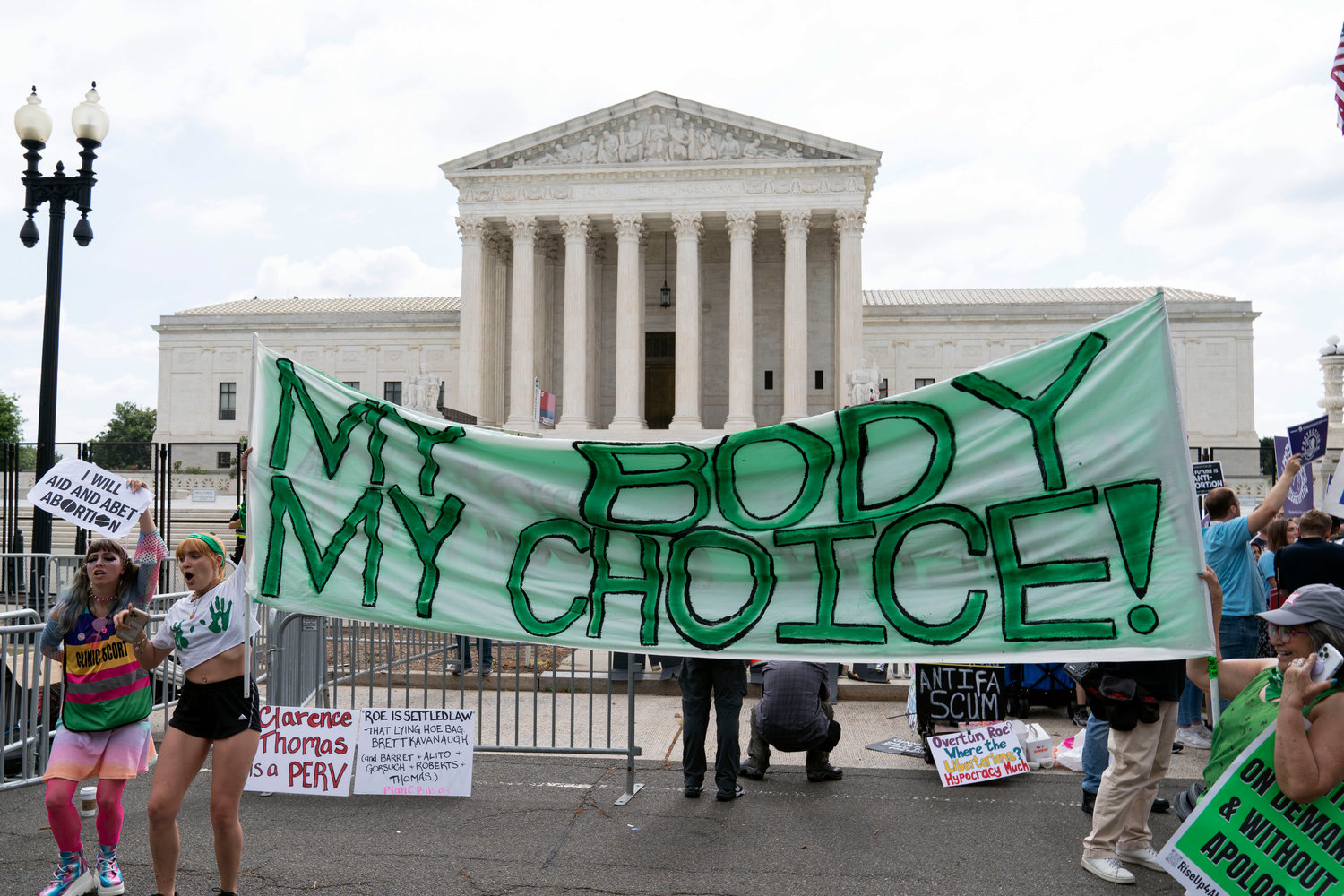 Abortion right activists gather outside the Supreme Court in Washington, Friday, June 24, 2022. The Supreme Court has ended constitutional protections for abortion that had been in place nearly 50 years, a decision by its conservative majority to overturn the court's landmark abortion cases. (AP Photo/Jose Luis Magana)