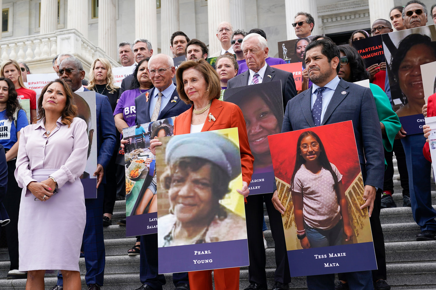From left, Rep. Veronica Escobar, D-Texas, House Speaker Nancy Pelosi of Calif., and Rep. Jimmy Gomez, D-Calif., listen as they attend an event on the steps of the U.S. Capitol about gun violence Friday, June 24, 2022. (AP Photo/J. Scott Applewhite)