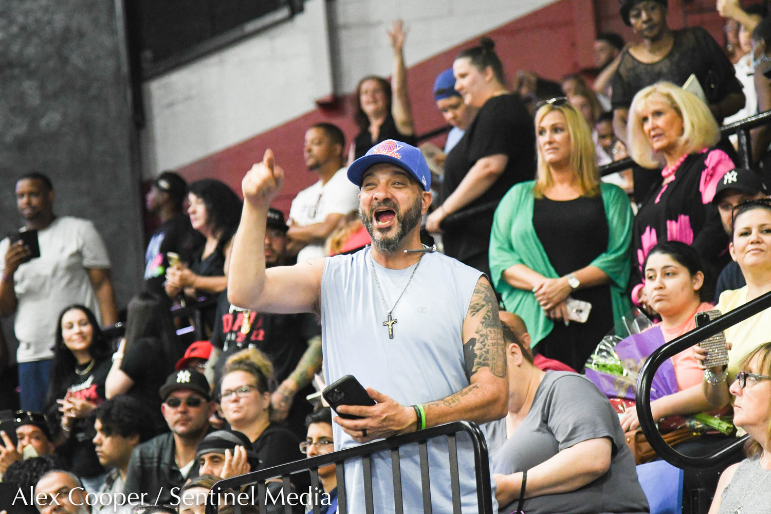 A man from the crowd yells in excitement during the annual commencement ceremony for Thomas R. Proctor High School graduates took place on Friday at the Adirondack Bank Center at the Utica Memorial Auditorium.