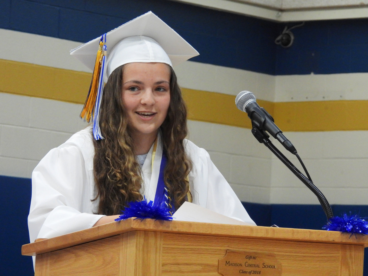 Salutatorian Maria Peavey speaks to the graduating class during the graduation ceremony in Madison on Friday.