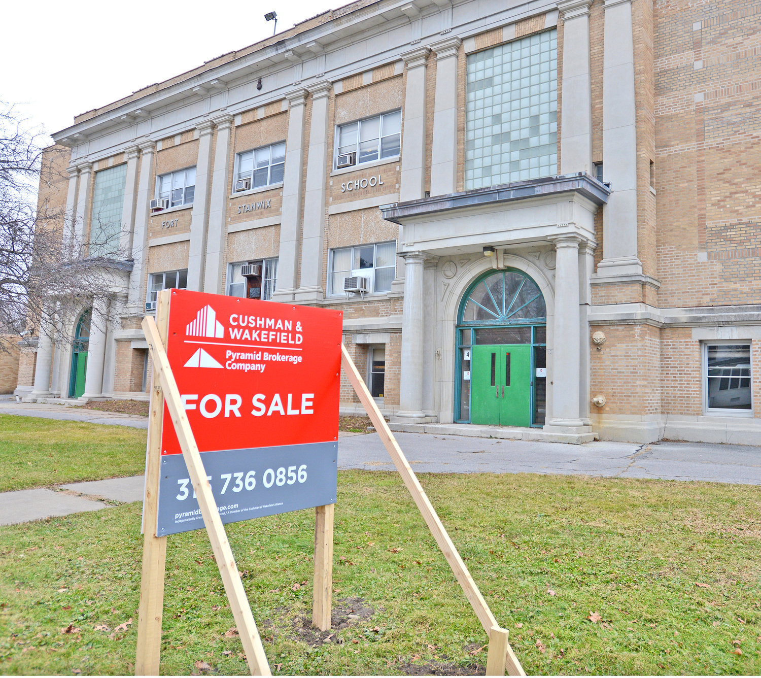 The former Fort Stanwix Elementary School, at 110 W. Linden St., in Rome, sits empty with a “for sale” sign in front in this Sentinel file photo. Efforts to sell the parcel continue, and the Rome City School District’s board of education has approved a resolution to extend a contract with the Pyramid Brokerage Company to help sell the property.