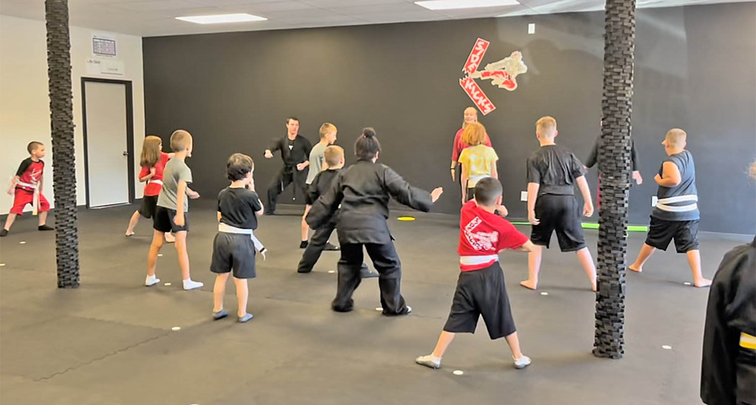 Children ages 4 and older learn some karate basics during a recent introduction to the martial art at Sidekick Karate’s new studio, 239 Oriskany Blvd., in  Whitesboro.
