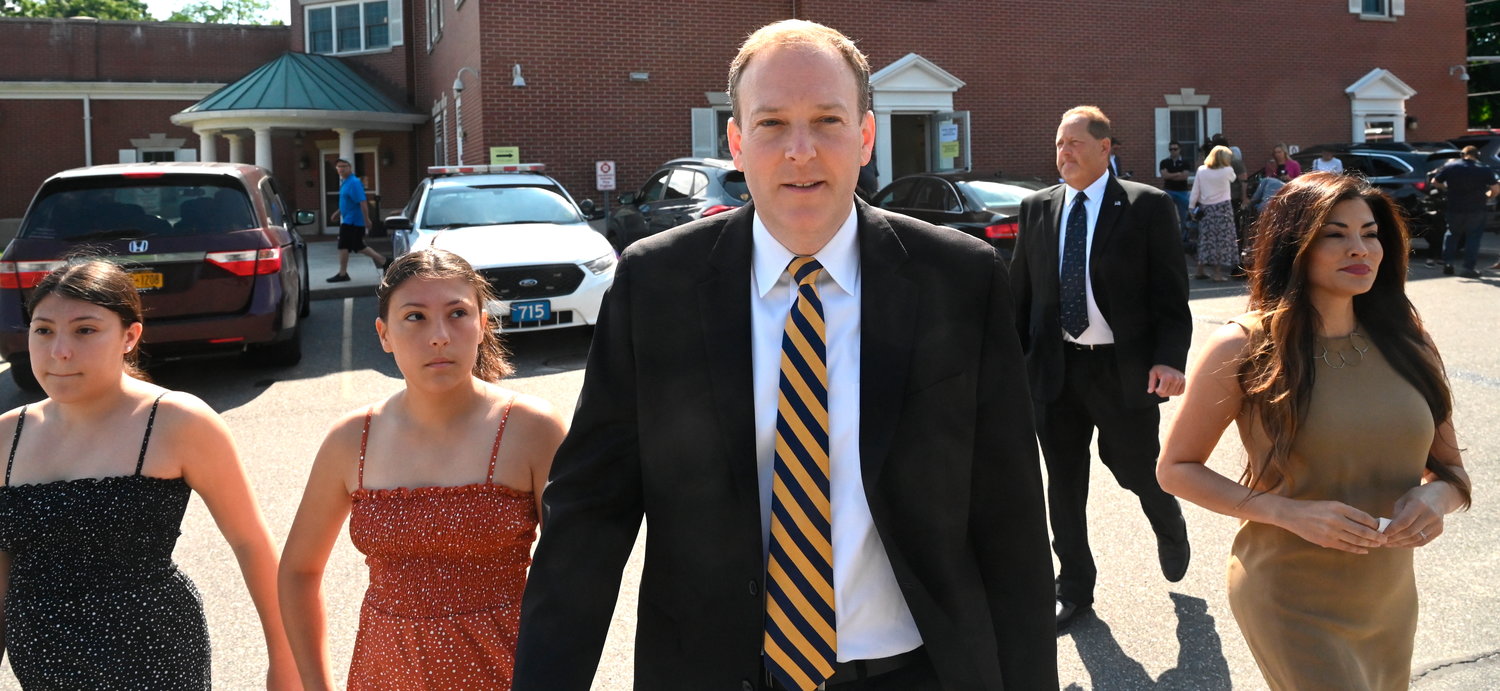 Republican candidate for governor and U.S. Rep. Lee Zeldin leaves the Mastic Beach firehouse with his family.