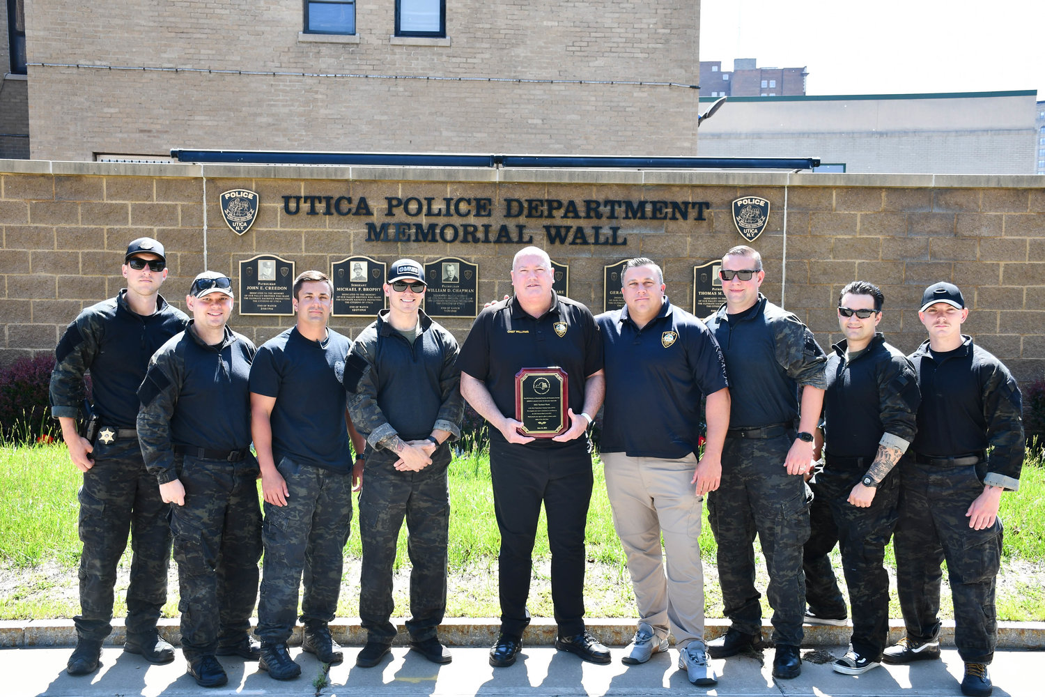 SWAT TEAM VICTORY — The Utica Metro SWAT Team was recognized as the winners of the Tactical Week training at the New York State Preparedness Center in Whitestown last week. Five SWAT teams from across the state competed in a series of high intensity training scenarios, and state officials said the Metro SWAT Team scored the highest. Here they are posing with Utica Police Chief Mark Williams, center. The Metro SWAT Team is comprised of officers from the Utica and New Hartford police departments, as well as the Oneida County Sheriff’s Office.