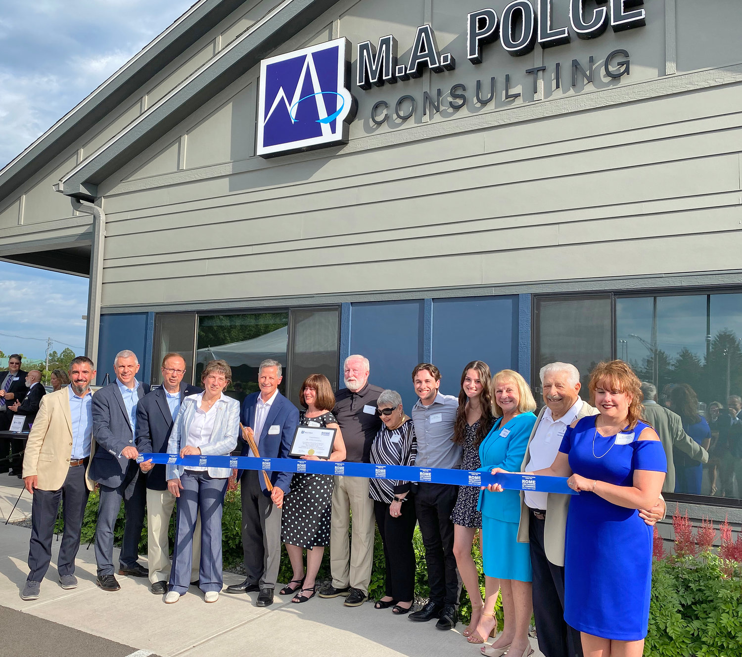 M.A. Polce, 401 Phoenix Drive, Rome, celebrated the facility’s almost 10,000 square-foot expansion during a ribbon cutting ceremony at Rome Area Chamber of Commerce’s Business After Hours event Wednesday. M.A. Polce President and CEO Michael A. Polce, fifth from left with scissors, cut the ceremonial ribbon.  He was joined by family members and staff, as well as, from left: Gregory A. Mattacola, first vice-chairman of the Board of Directors of the Rome Chamber; County Executive Anthony J. Picente Jr.; Sen. Joseph A. Griffo, R-47, Rome; and Mayor Jacqueline M. Izzo.