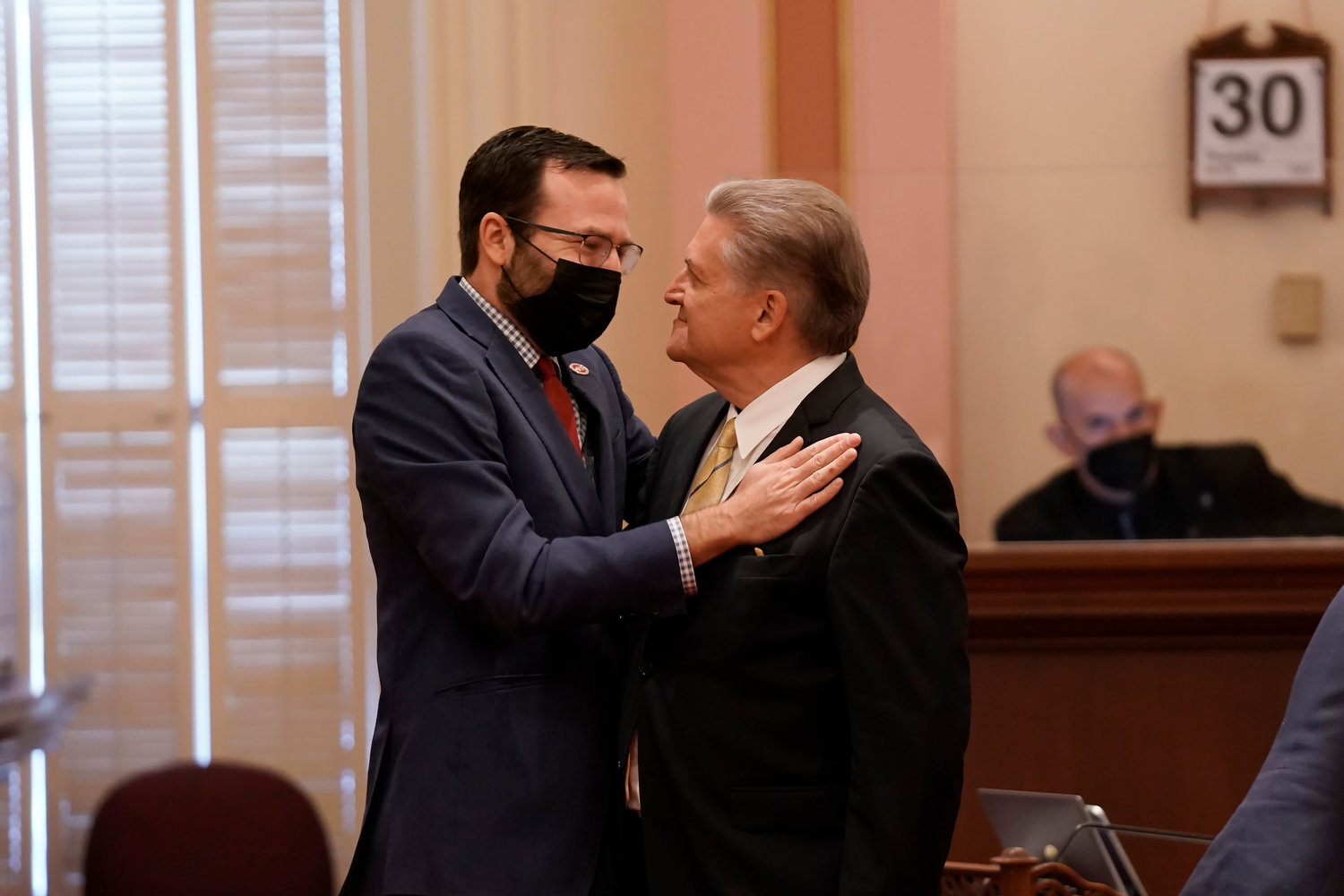 California state Sen. Ben Allen, D-Santa Monica, left, is congratulated by Sen. Bob Hertzberg, D-Van Nuys, after his measure aimed at reducing plastic packaging passed the state Senate at the Capitol in Sacramento, Calif., Thursday, June 30, 2022. It says makers of single-use plastic products must reduce the use of the material 25% by 2032.The bill now goes to Gov. Gavin Newsom. (AP Photo/Rich Pedroncelli)
