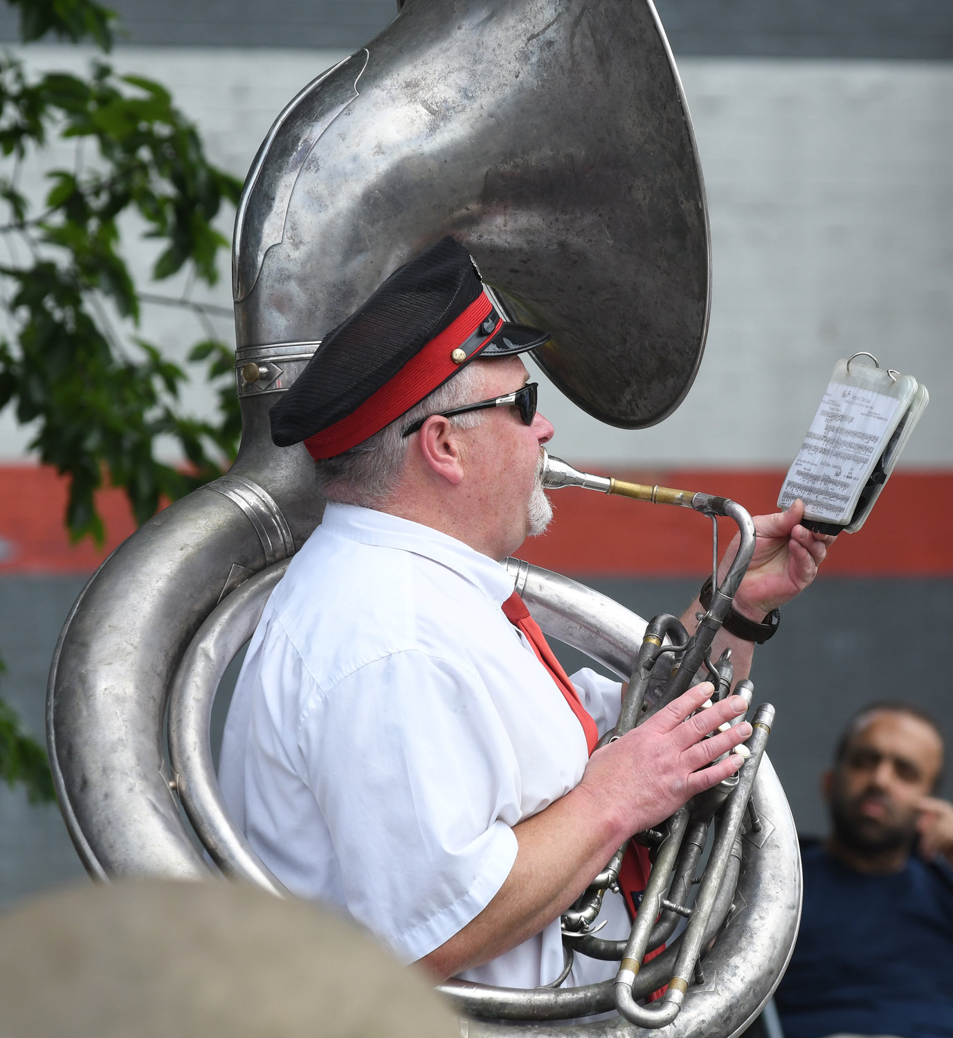 A tuba player keeps the beat as the La Banda Rossa marching band performs in Monday’s parade in Utica.