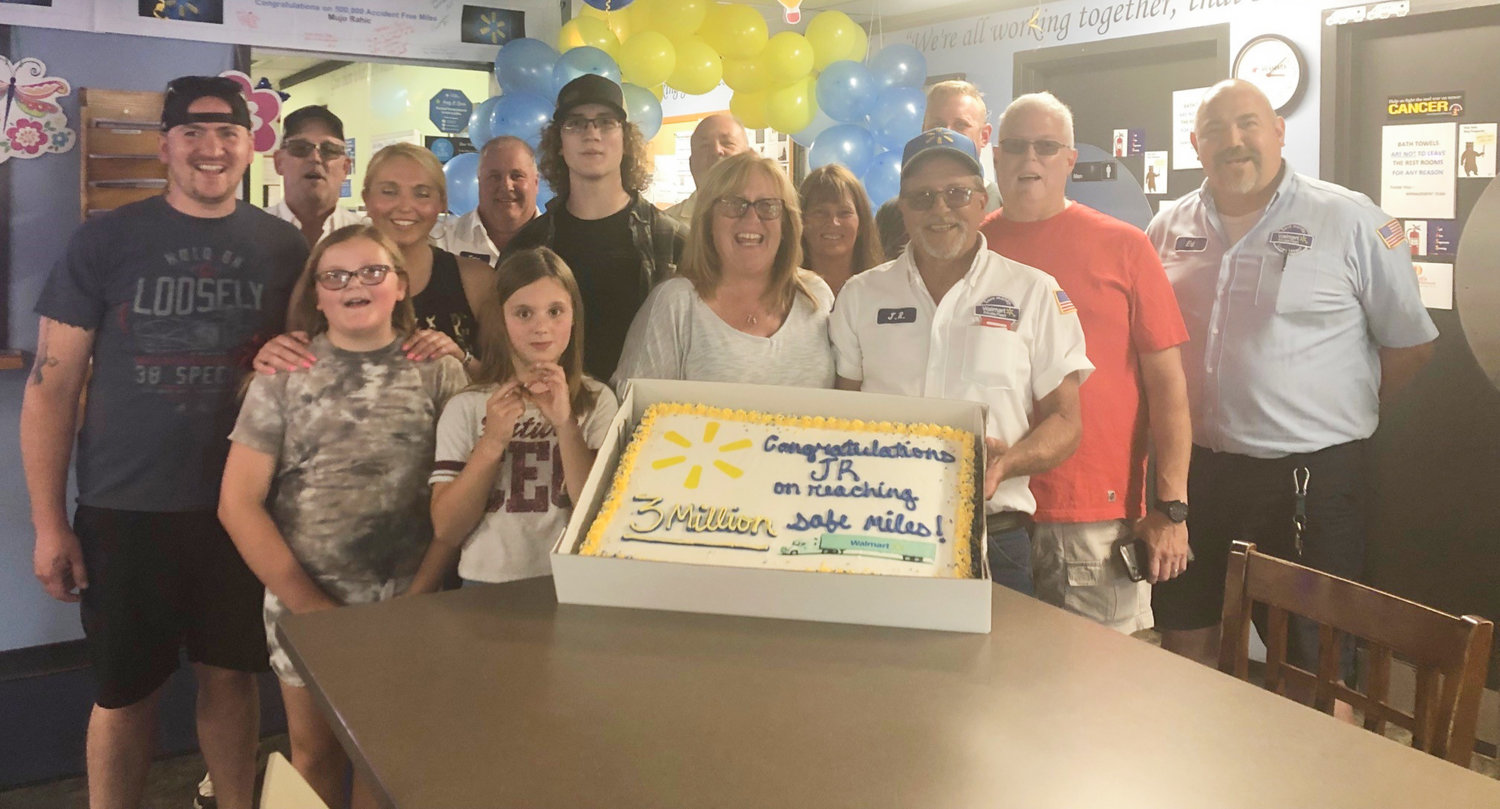 Walmart celebrated and congratulated one of its Distribution Center drivers for driving three million miles safely over the course of his 28 year career. Pictured is John Reed holding onto his cake with his friends, family, and coworkers.