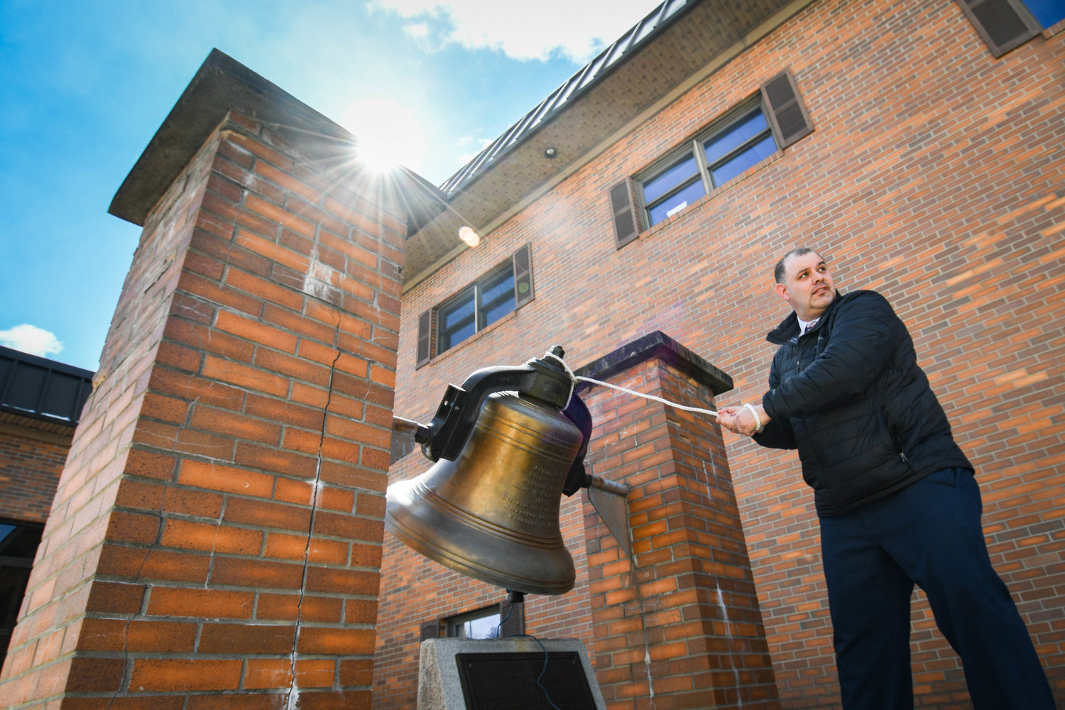 New York Mills mayor Ernie Talerico rings a bell outside of the village’s fire department in this file photo. The village has a day of activities planned to celebrate its centennial on Saturday, July 9, at Pulaski Park.