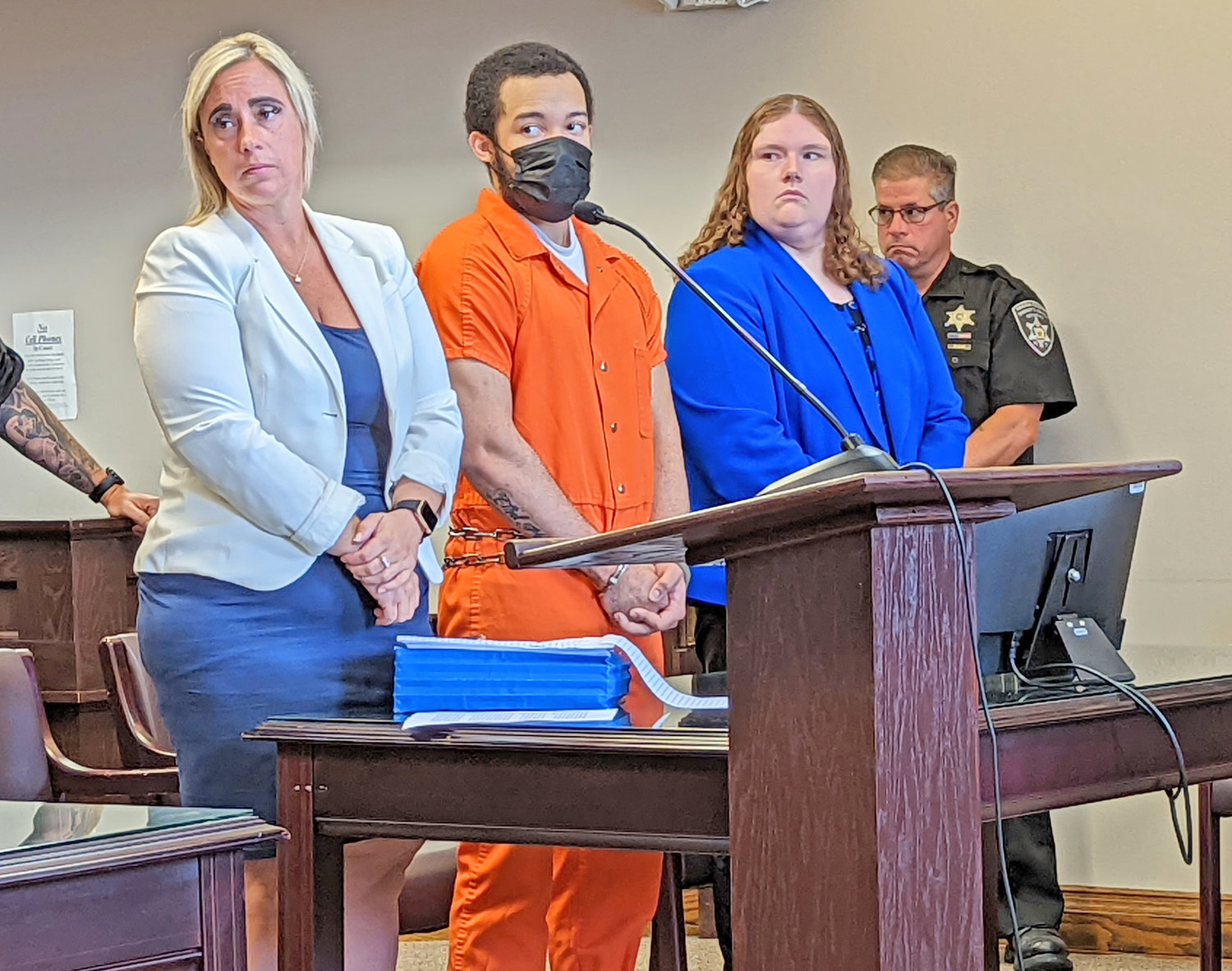 Rakwan Marshall is flanked in court by his defense team, Krystal Harrington, left, and Megan Hartl.