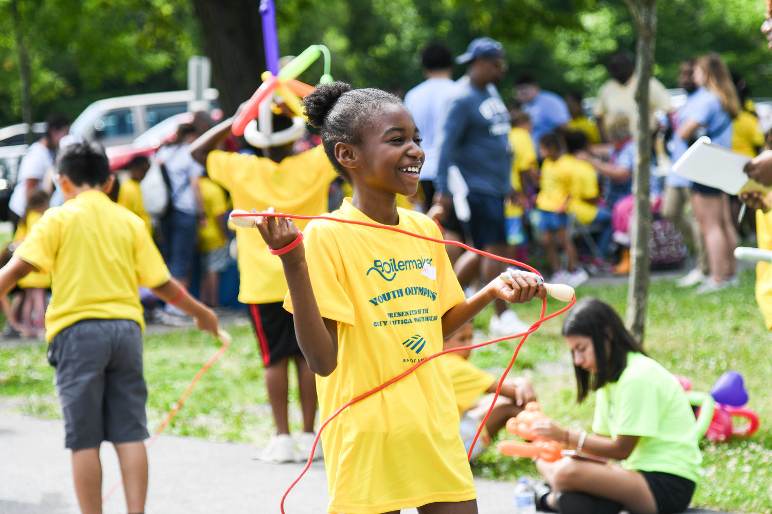 Renee Greene jumps rope during the Boilermaker Youth Olympics on Thursday at T.R. Proctor Park in Utica. The event is for children ages 6-13 from the city of Utica. The event was free and each child received a T-shirt. The first year of the event 300 children participated. The event has grown to 500 participants. Employees from Bank of America and the city of Utica help the children with the events, which include basketball, baseball, jump rope, kickball, disc golf, hockey shootout and balloon toss as well as checkers and Connect Four.