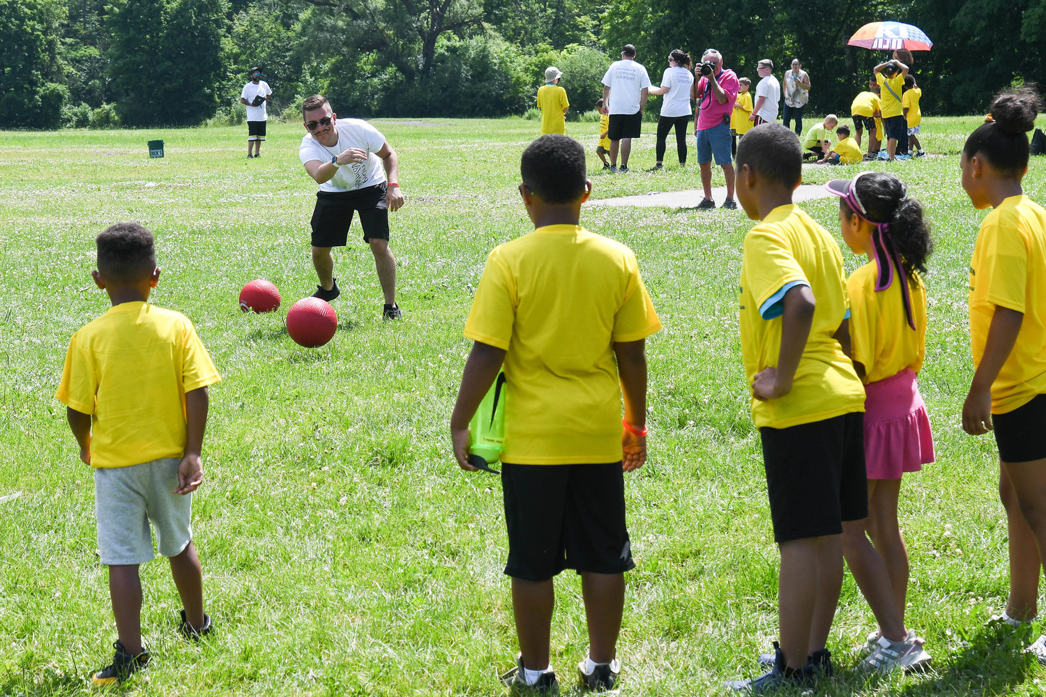 Children play kickball during the Boilermaker Youth Olympics on Thursday at T.R. Proctor Park in Utica.