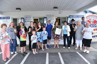 Assemblywoman Marianne Buttenschon, D-119, Marcy, along with local farmers, agricultural ambassadors and Mayor Jacqueline M. Izzo, celebrate the designation of July as Ice Cream Month in New York with a visit to Nicky Doodles, 1159 Erie Blvd. W.