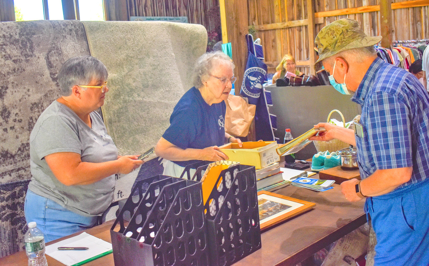 Volunteers facilitate check-out at the Great Swamp Conservancy garage sale.