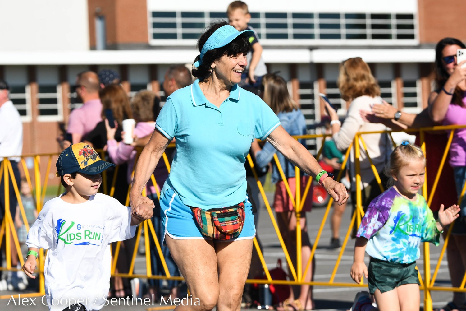 Children and their family members participate in the Utica National Kids Run at Mohawk Valley Community College in Utica on Saturday.