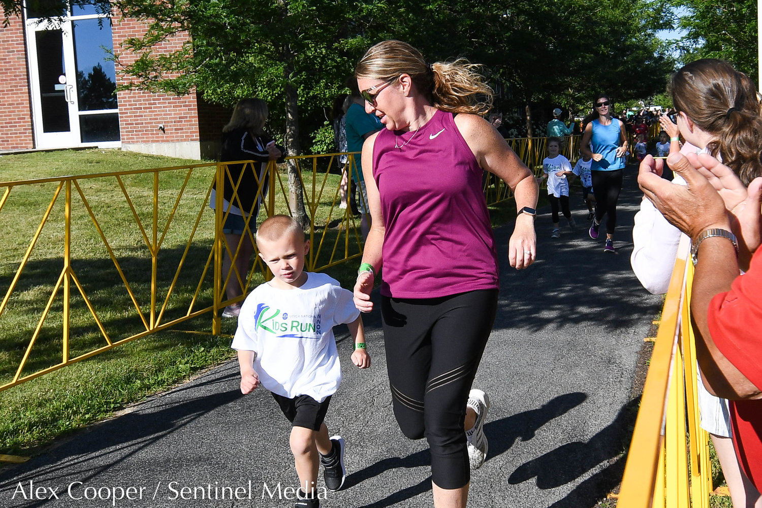 Children and their family members participate in the Utica National Kids Run at Mohawk Valley Community College in Utica on Saturday.