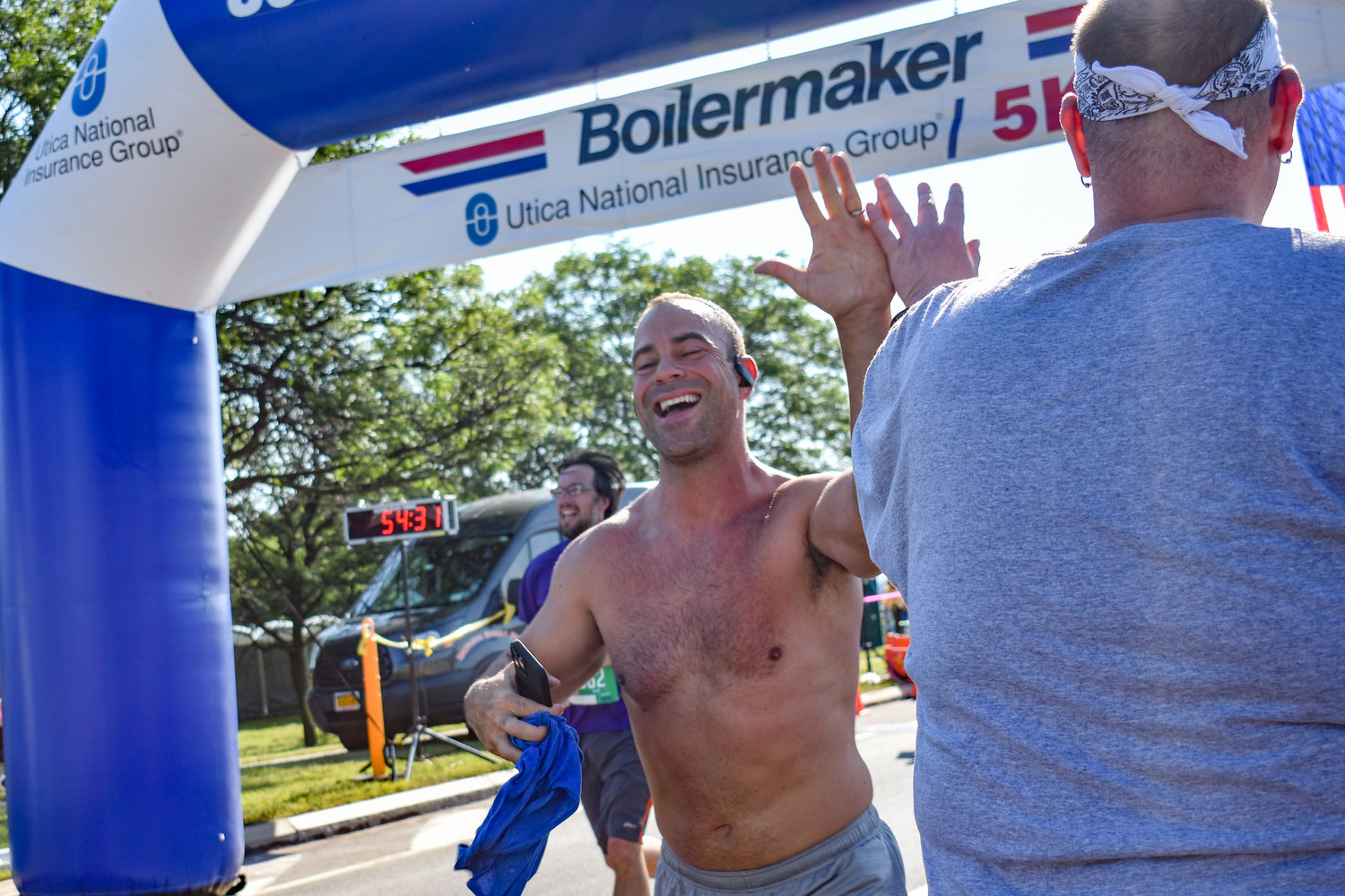 Runners in the 45th Boilermaker Road Race celebrated making it two-thirds of the way after passing the 5K starting line.