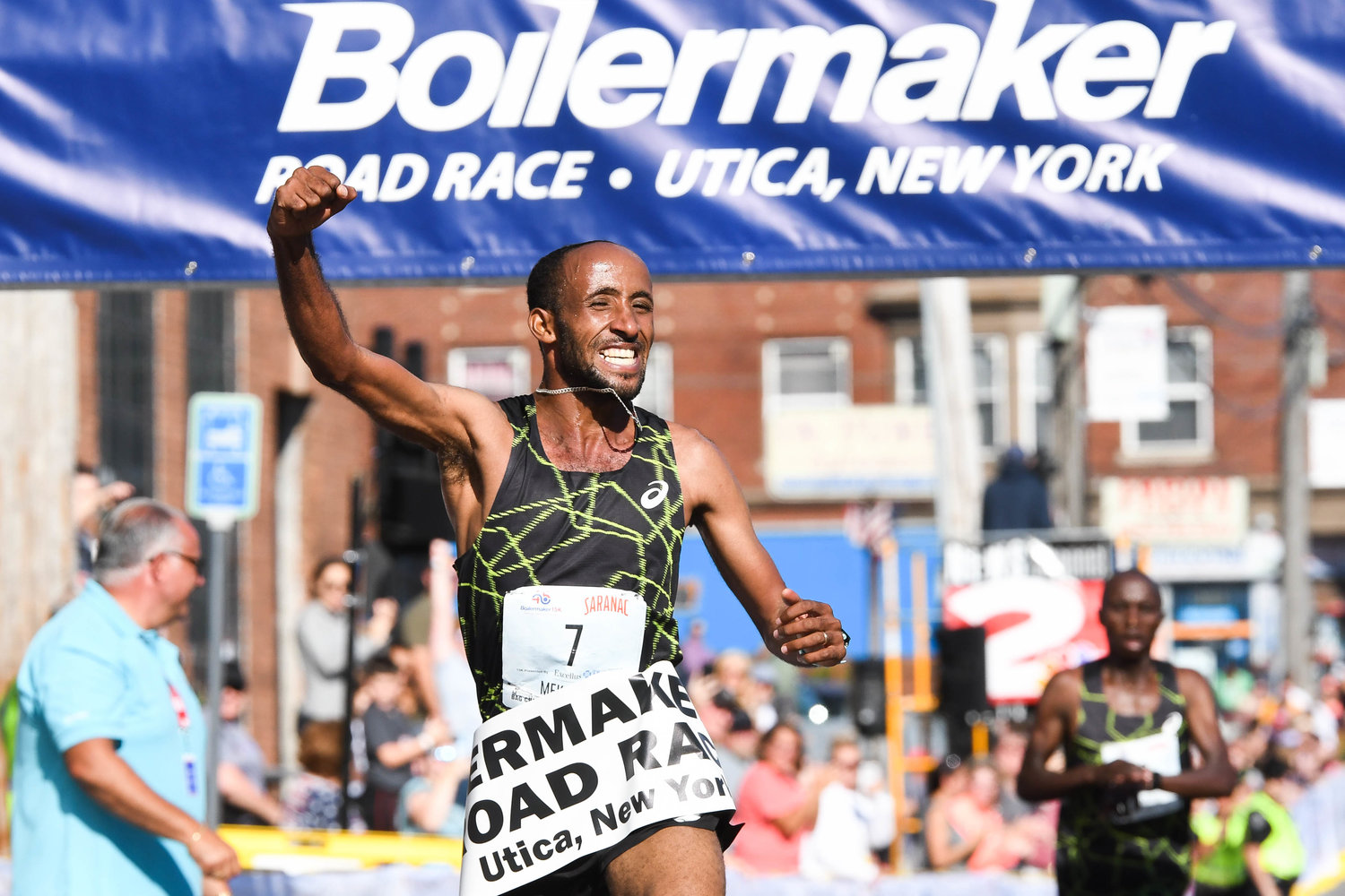 Jemal Yimer Mekonnen celebrates after finishing 1st in the 15K during the 45th Boilermaker Road Race on Sunday, July 10 in Utica.