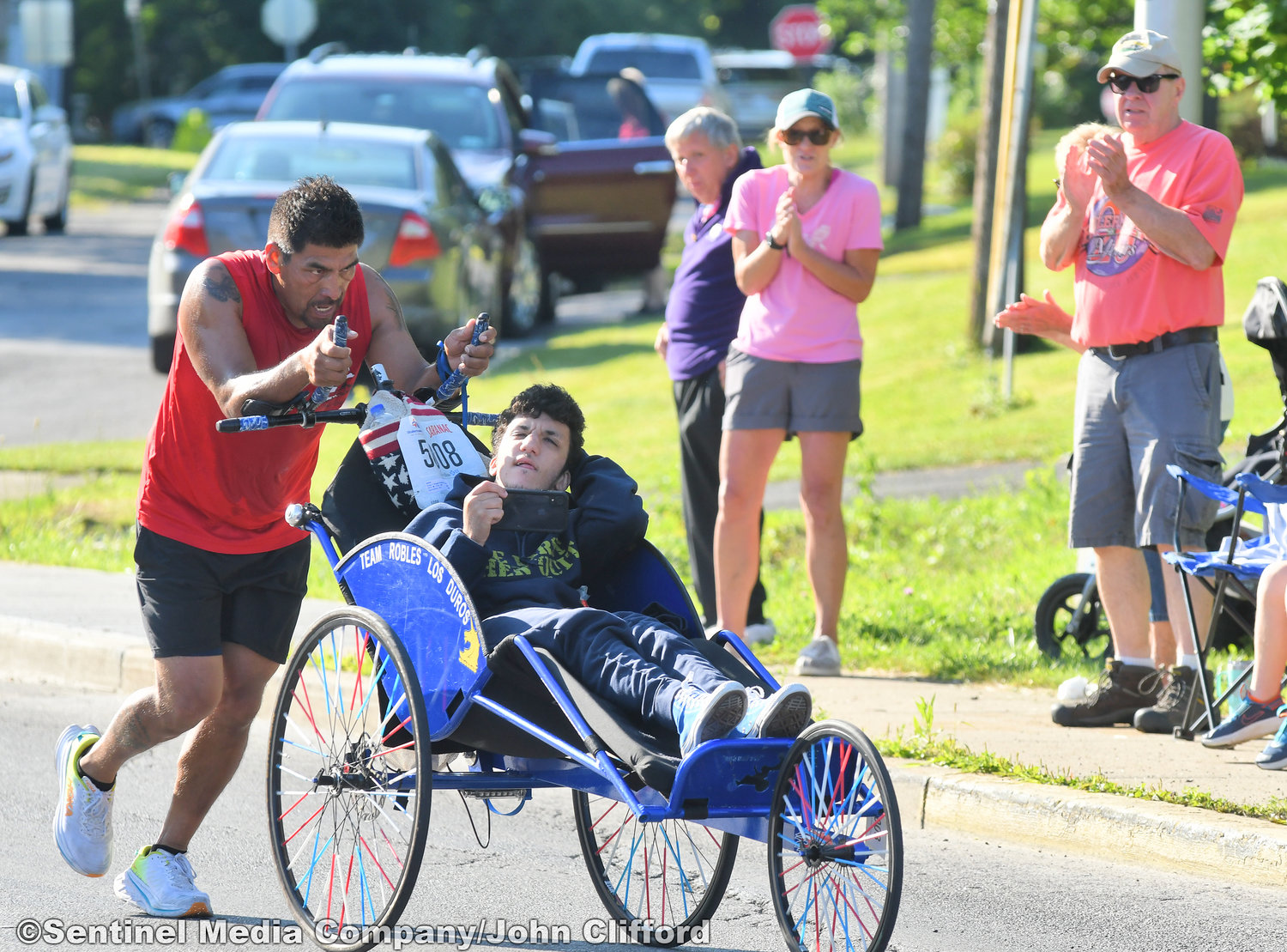 Wheelchair racer in the 45th Boilermaker Road Race makes the turn left from Memorial Parkway to Valley View Road.