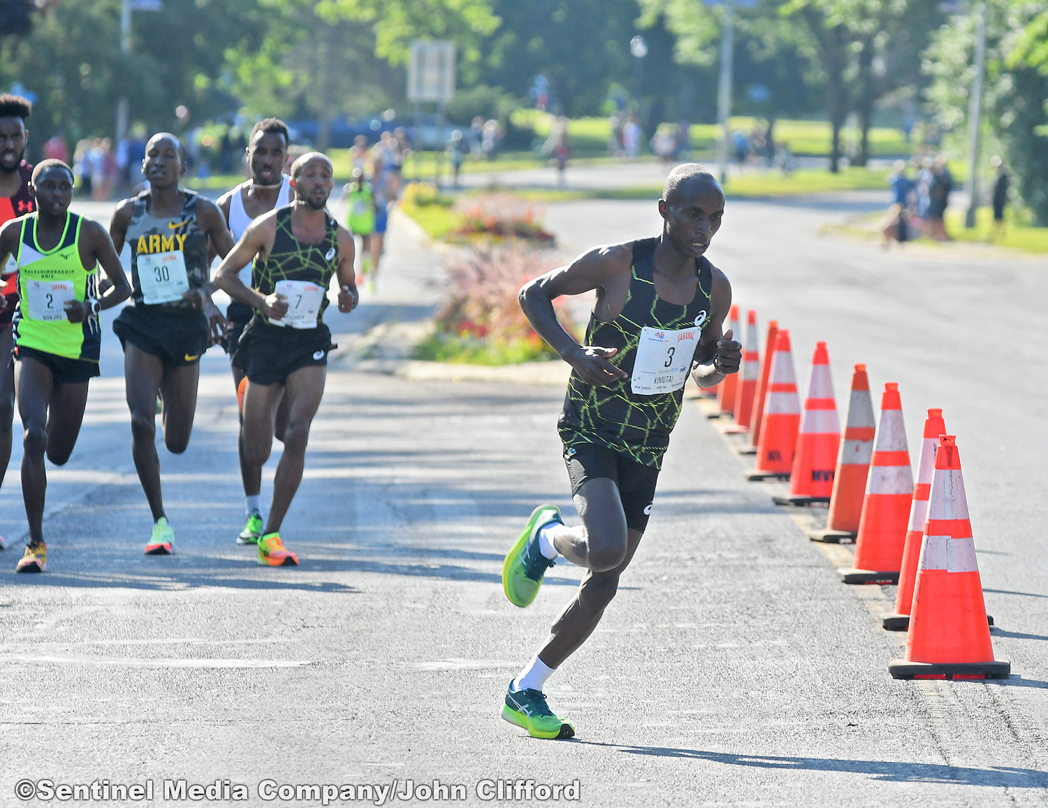 The first runner of the 15K Edwin Kimutai of Kenya, of the 45th Boilermaker Road Race makes the turn left from Memorial Parkway to Valley View Road.