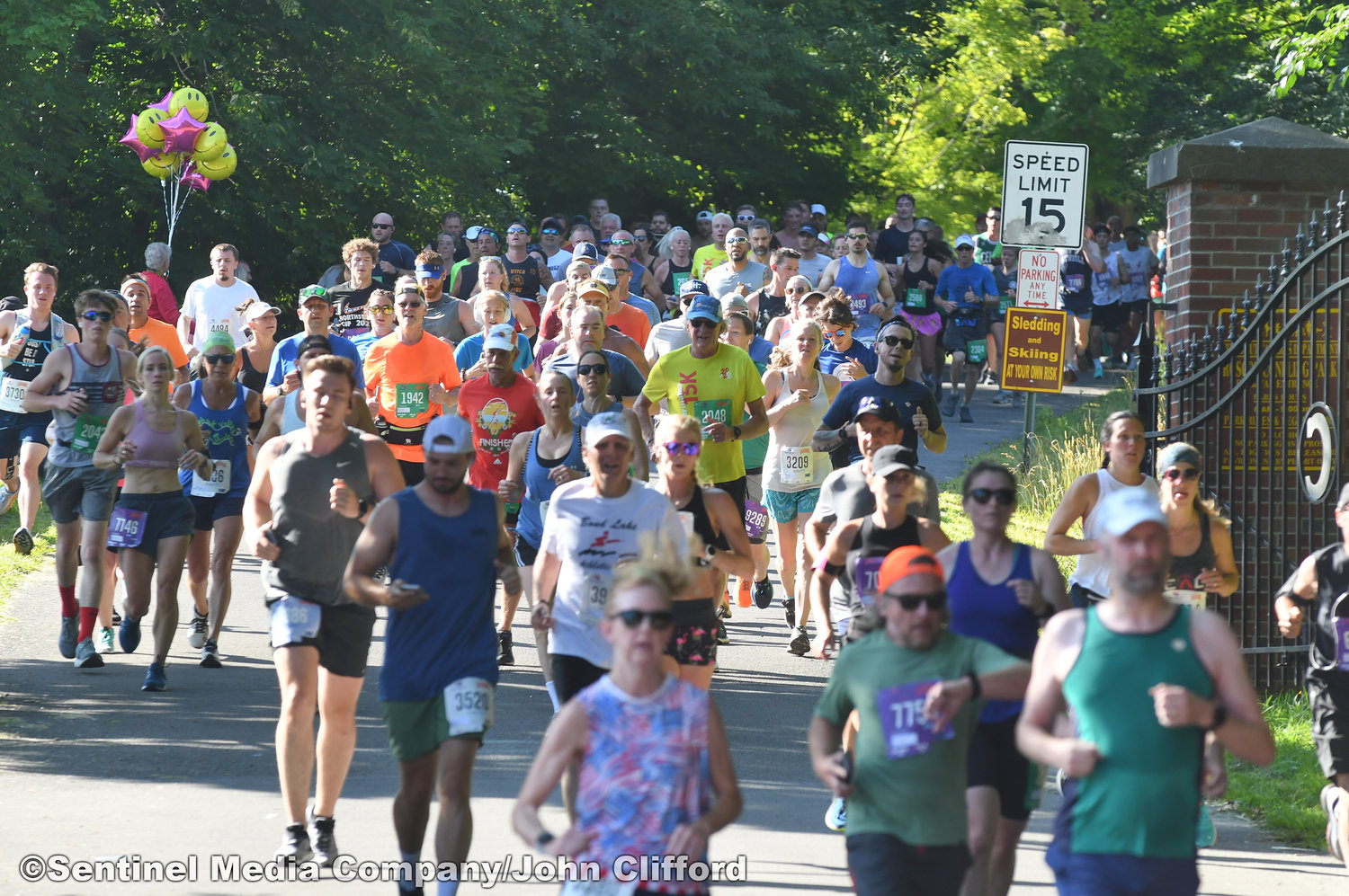15k runner runners come down Master Garden Road on to  Memorial Parkway during the 45th Boilermaker Road Race.