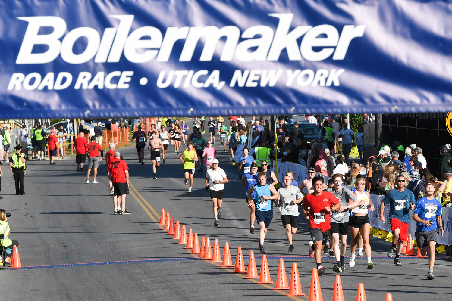 Runners make their way to the finish line during the 5K at the 45th Boilermaker Road Race on Sunday in Utica.