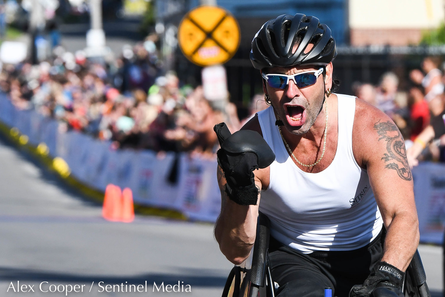 James Joseph crosses the finish line in the wheelchair 15K race during the 45th Boilermaker Road Race on Sunday, July 10 in Utica.