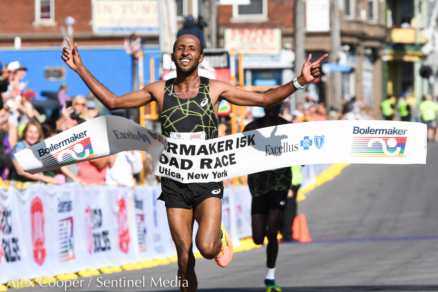 Jemal Yimer Mekonnen celebrates after finishing 1st in the men's 15K during the 45th Boilermaker Road Race on Sunday, July 10 in Utica.