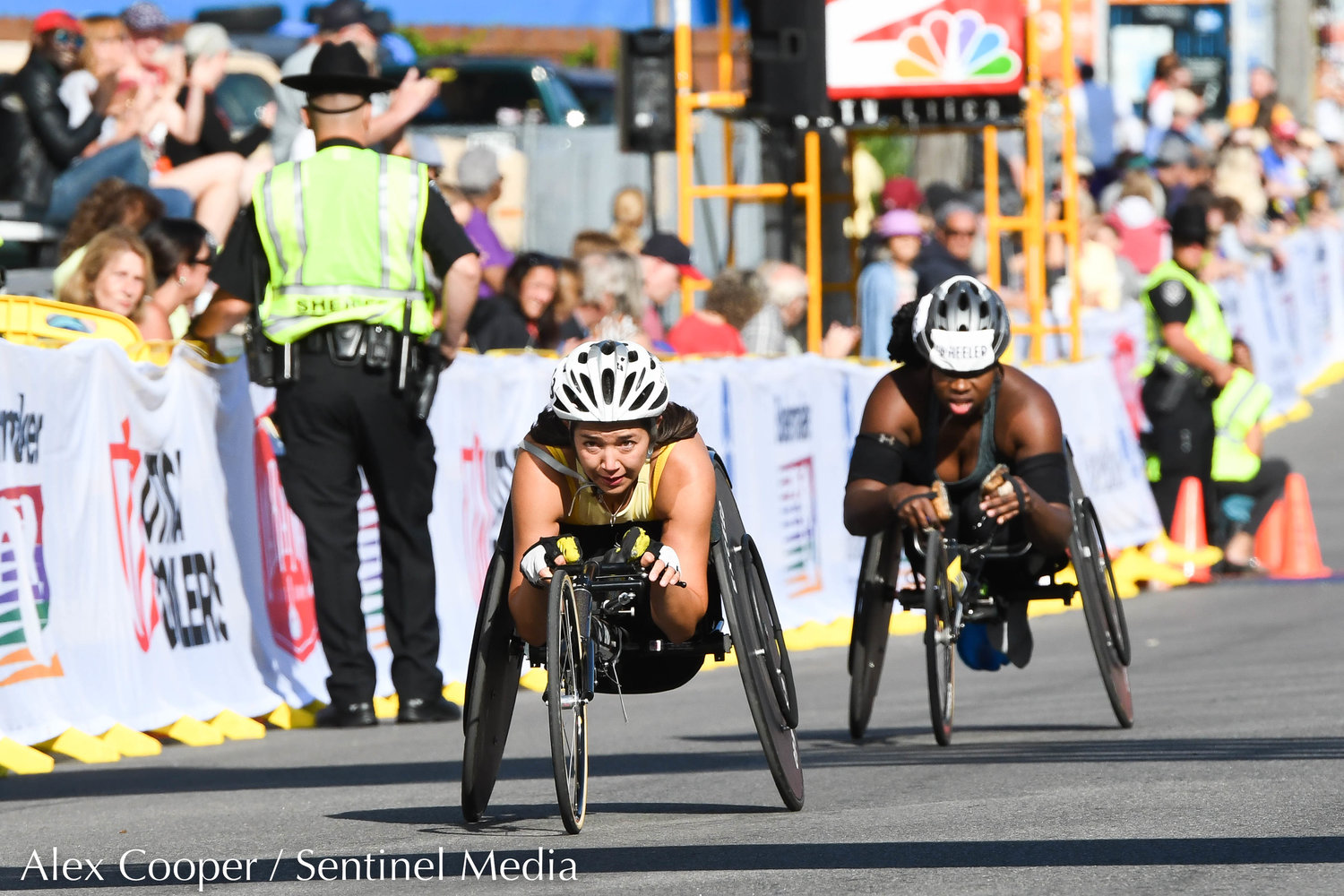 Wheelchair racers cross the finish line during the 45th Boilermaker Road Race on Sunday.