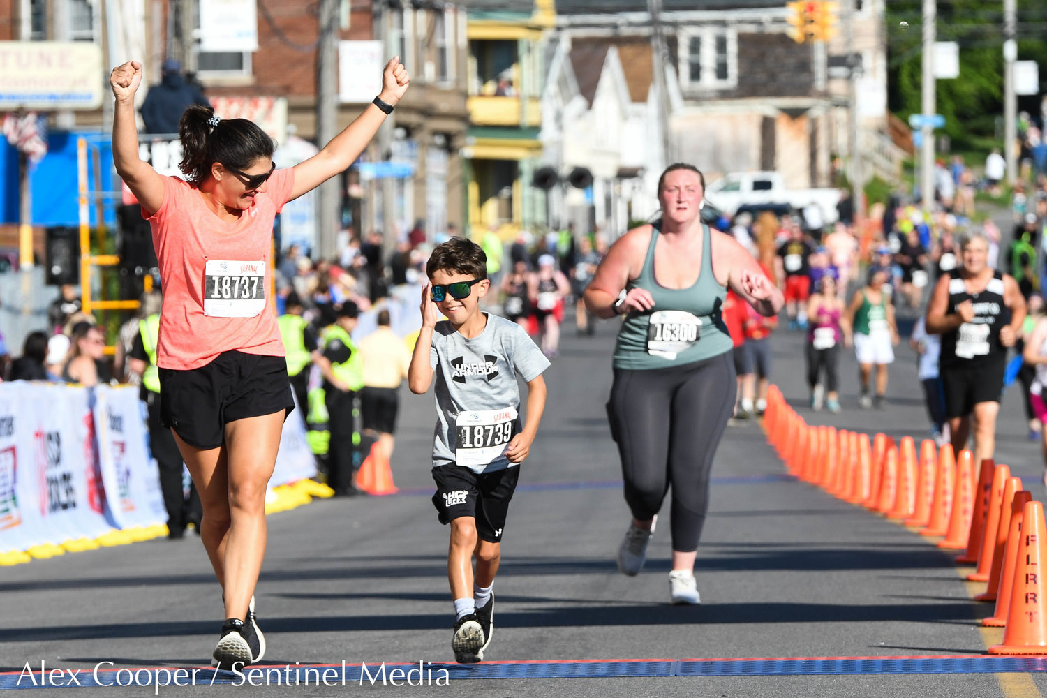 5K runners Amanda Yesensky and her son cross the finish line during the 45th Boilermaker Road Race on Sunday.