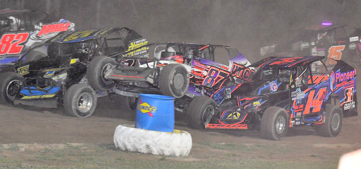 POPPING A WHEELIE — Sportsman No. 87 driver Rocco Leone pops a wheelie in traffic between No. 15 Kyle DeMetro and No. 14aj AJ Miller during feature action last Friday night at Utica-Rome Speedway.