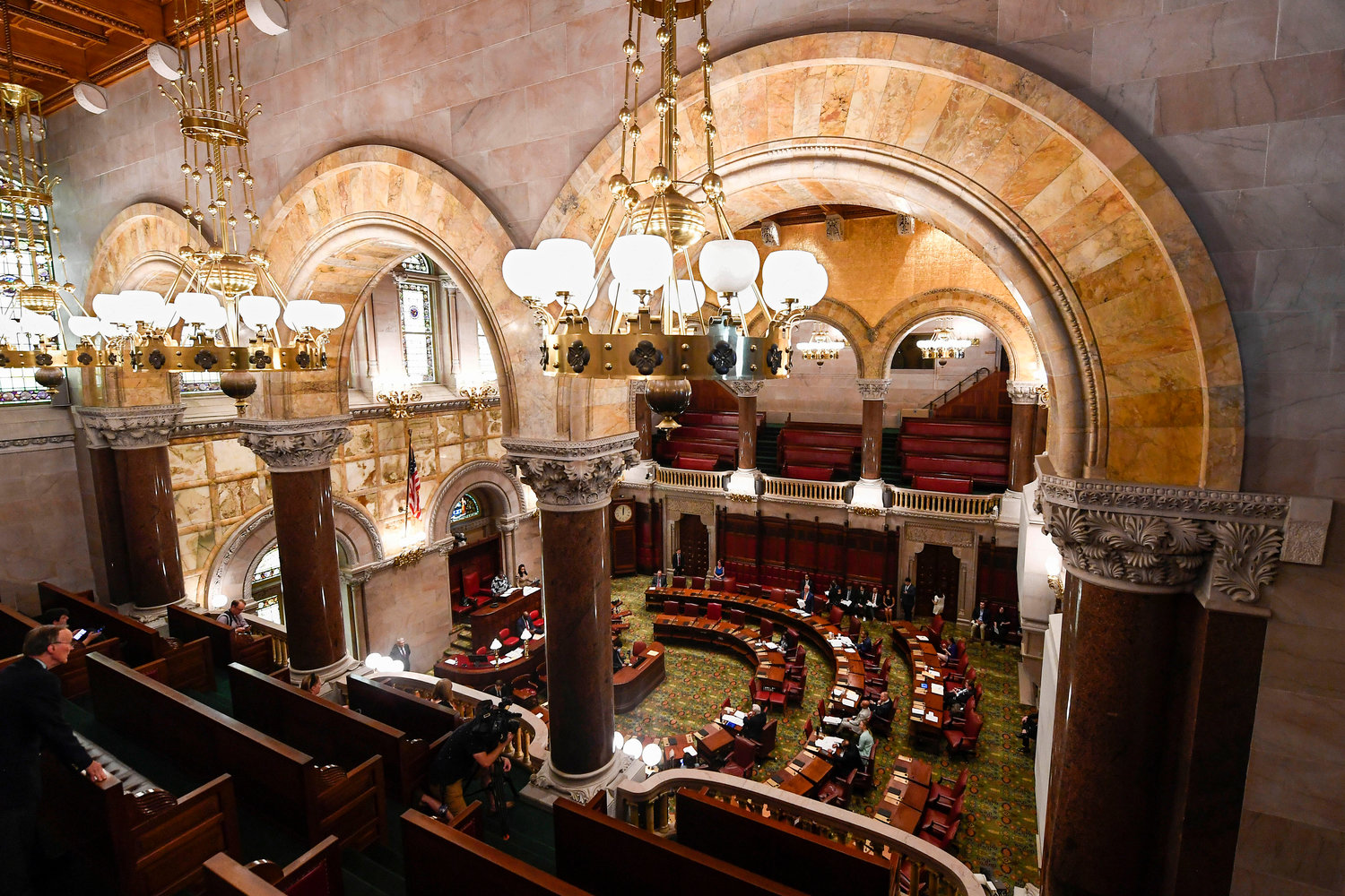 FILE — Members of the New York Senate, debate legislation to consider new firearms regulations for concealed-carry permits, during a special legislative session in the Senate Chamber at the state Capitol, July 1, 2022, in Albany, N.Y. A federal lawsuit challenging part of New York's new gun law was filed Monday, July 11, 2022, by Republican congressional candidate Carl Paladino, one of multiple legal challenges expected against state handgun licensing rules approved after a recent Supreme Court ruling.