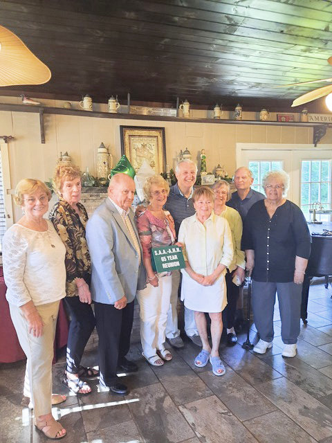 REKINDLING OLD MEMORIES — Members of the St. Aloysius Academy Class of 1957 gather for their 65-year reunion on July 7 at the Delta Lake Inn.  Among the former classmates gathering to share old memories and renew friendships were, from left: Margaret (Cardiff) Bratge; Sue (Traxell) Gigliotti; Charles Sprock; Jeanette (Toepp) Reid; Jerry Crouth, of Balston Spa; Lorraine (Trophia) Bobela, of Turin; Virginia (Wilson) Craiglow; Fred Schmandt; and Helen (Lawless) Sheldon.