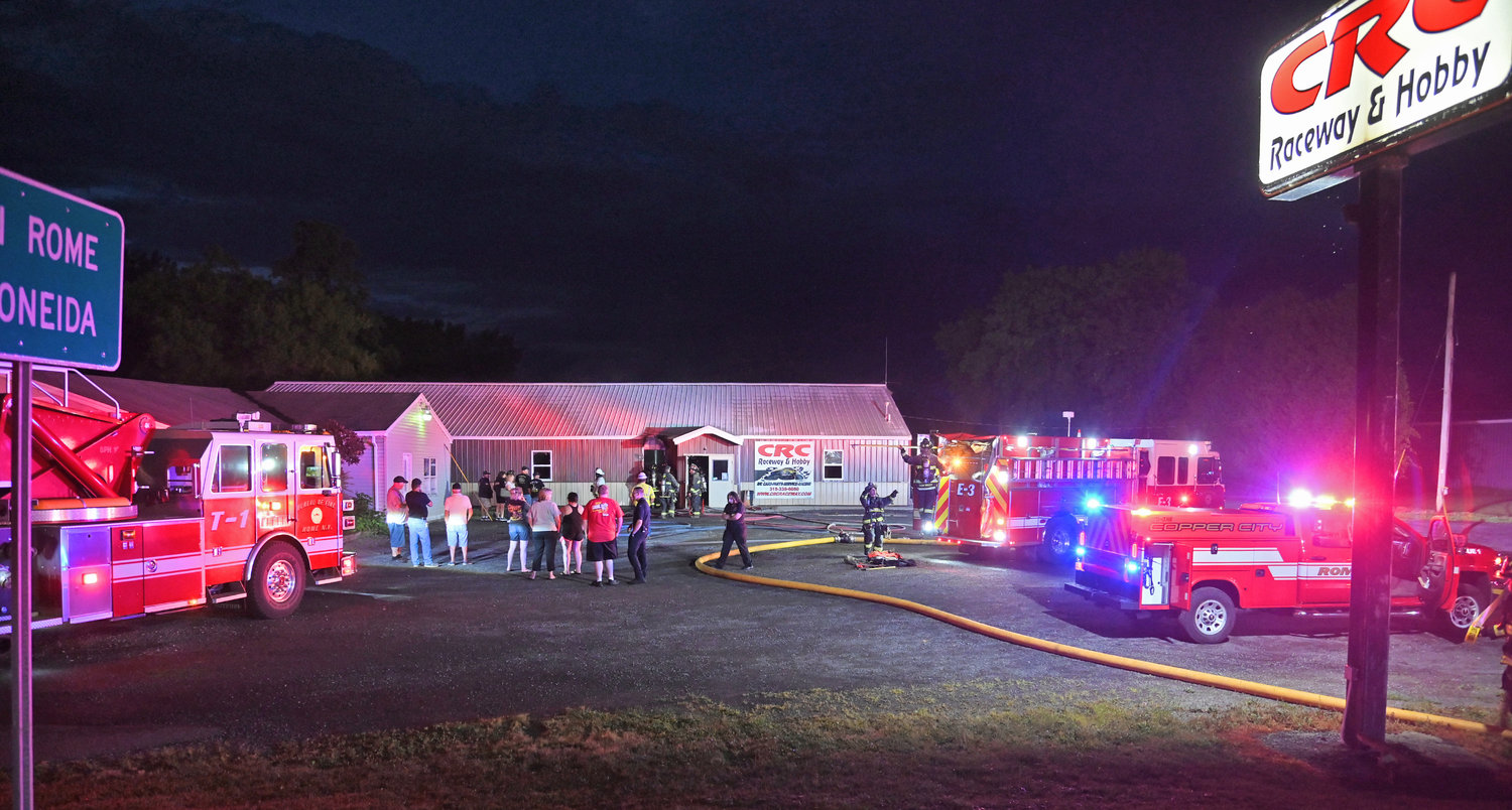 Rome firefighters knock down a fire at CRC Raceway & Hobby on Martin Street Wednesday night. The cause of the fire remains under investigation. Company officials said racing will be temporarily suspended until they can reopen.
