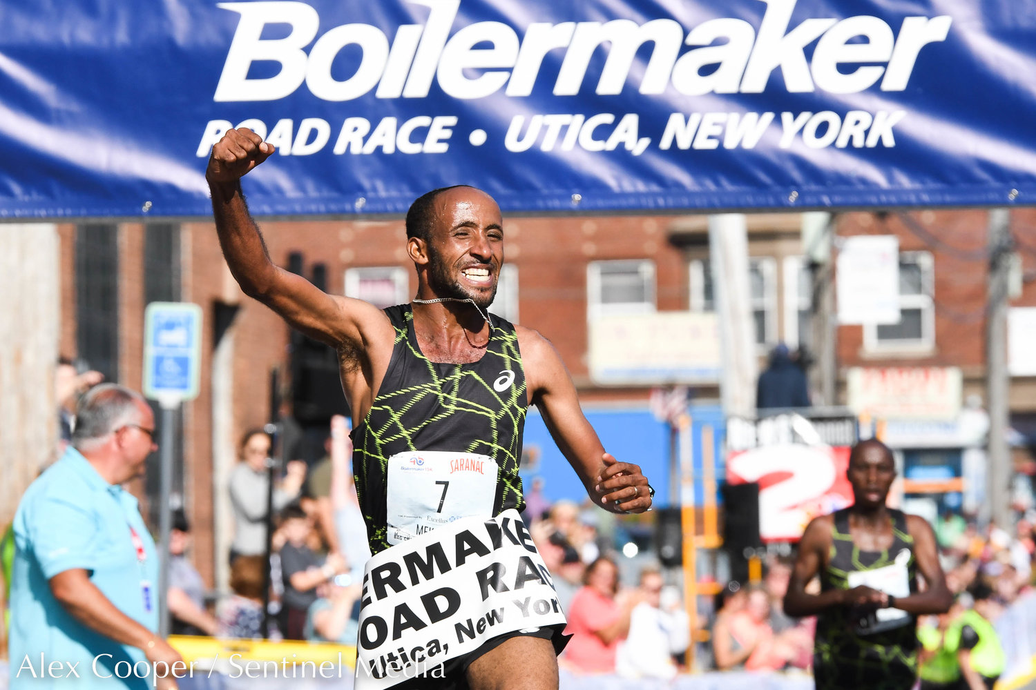 Jemal Yimer Mekonnen celebrates after finishing 1st in the men's 15K during the 45th Boilermaker Road Race on Sunday, July 10 in Utica.