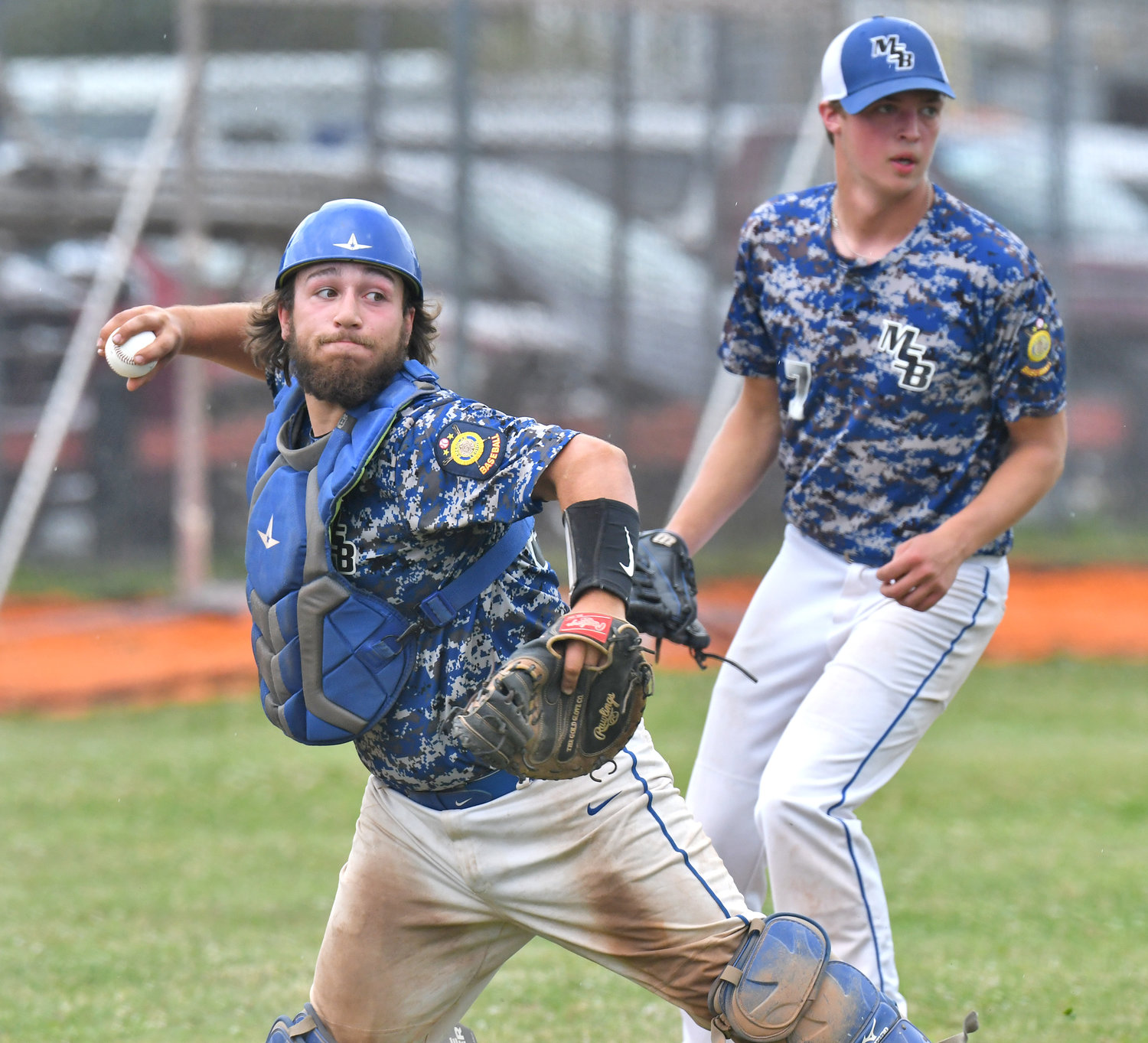 Moran Post catcher Cole Narolis throws to first base to retire Smith Post batter Kyle Williamson as pitcher Elijah Ciani looks on. The Camden-based team lost 5-4 on the road in the first round of the District V American Legion double-elimination baseball tournament.