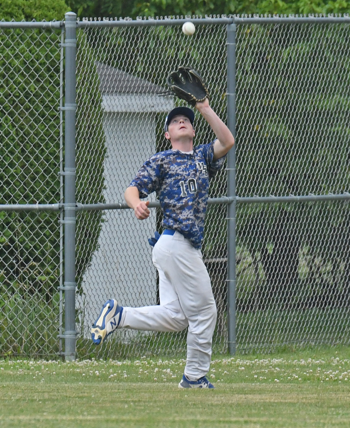 Moran Post outfielder Kohl lngalls makes a catch of long fly ball.