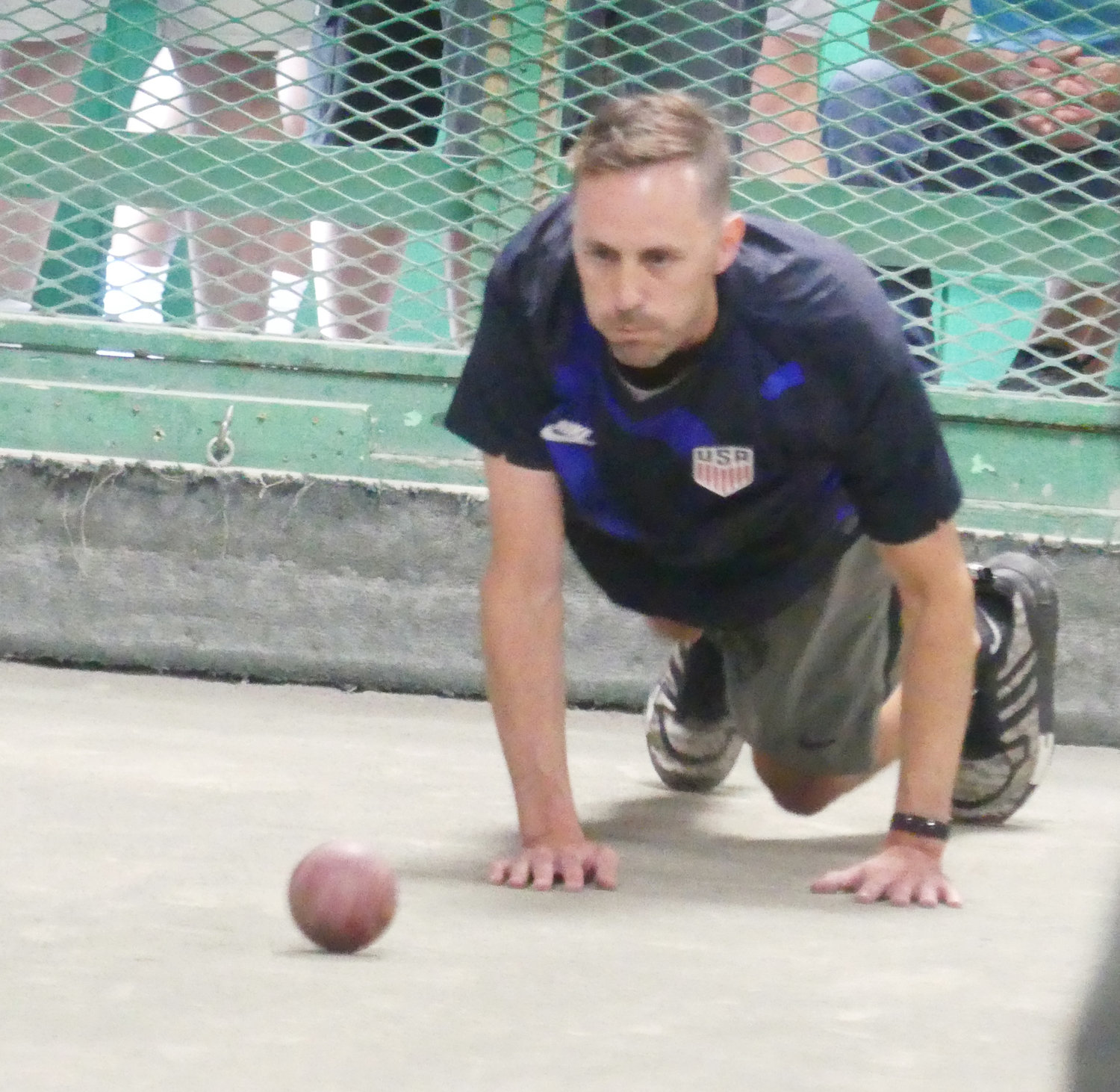 Joe Zdesar gets in position for a shot Friday during his team's match against Versace Law Office at the Toccolana Club in Rome. Zdesar, who is from Cleveland, Ohio, was part of a team named ABV competing in the 47th World Series of Bocce.