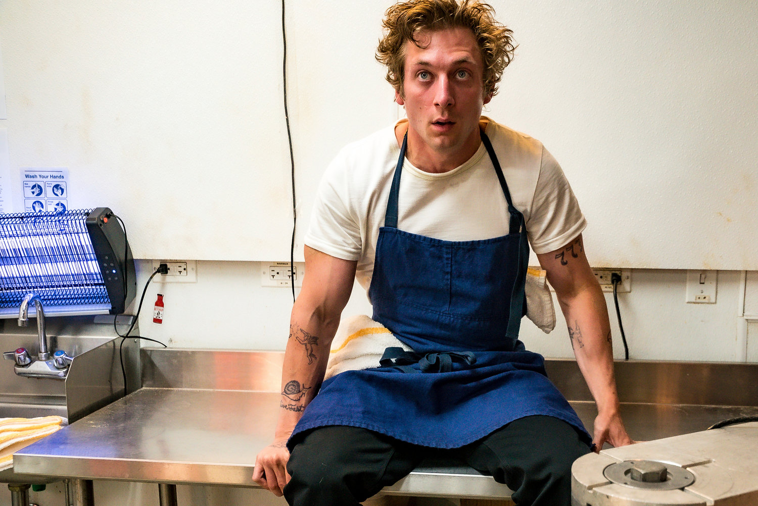 This image released by FX shows Jeremy Allen White in a scene from "The Bear." White stars as Carmen "Carmy" Berzatto, a five-star chef running a Chicago dive sandwich shop that he inherited from his older brother. (Matt Dinerstein/FX via AP)