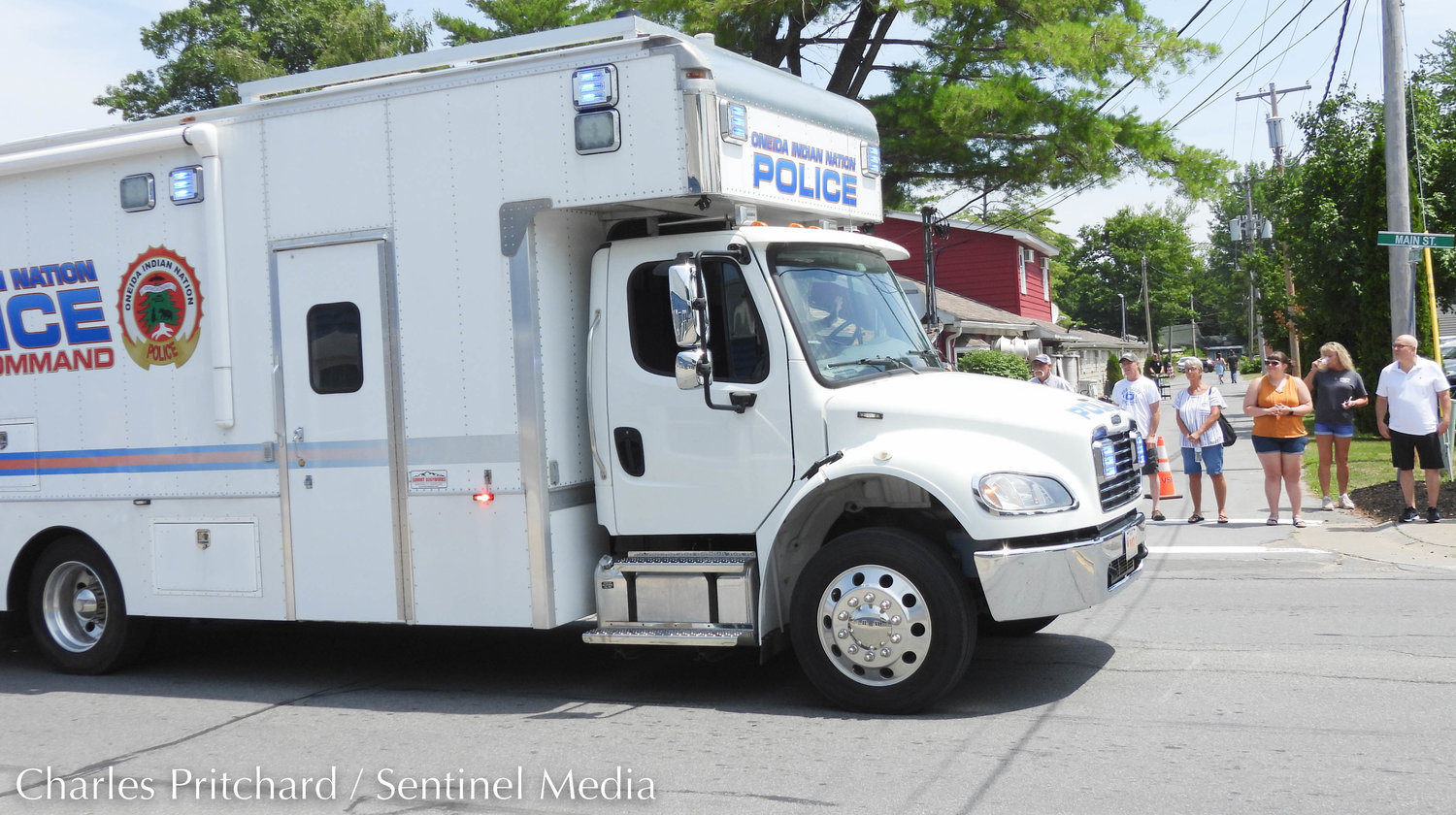 The Sylvan Beach Pirate's Parade makes its way down Main Street. Pictured is the Oneida Indian Nation Police Department's mobile command, with drivers waving to parade attendees.