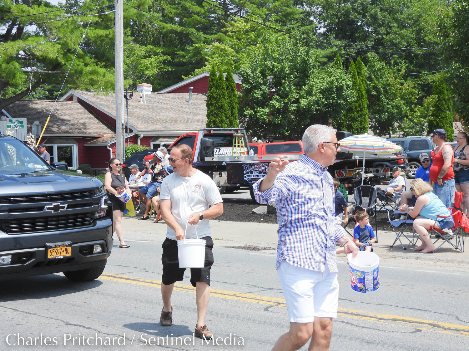 The Sylvan Beach Pirate's Parade makes its way down Main Street. Pictured is Senator Joe Griffo and Oneida County Executive Anthony Picente, handing out candy to parade attendees.