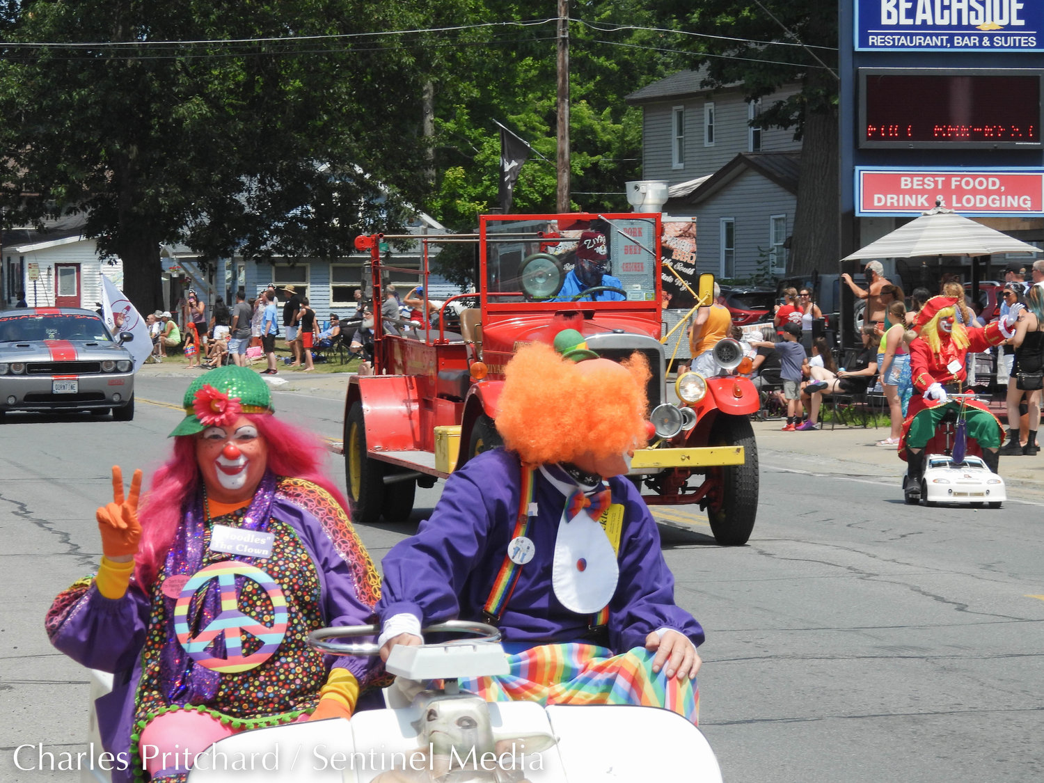The Sylvan Beach Pirate's Parade makes its way down Main Street. Pictured are clowns in the Pirate's Parade earning laughs and giggles from parents and children alike as they zoom around the parade.